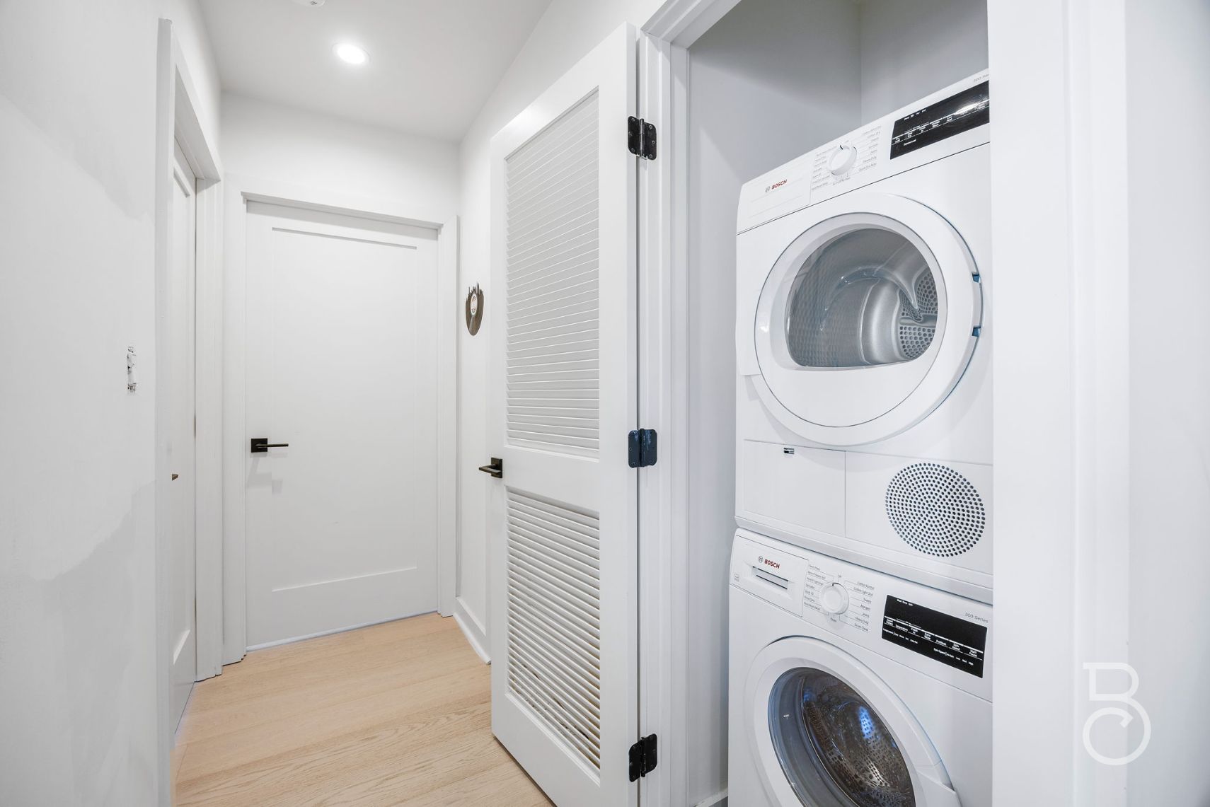 25-74 34th Street, Unit 4C Queens, NY 11103 - Photo 12 of 15 a view of a hallway with washer and dryer