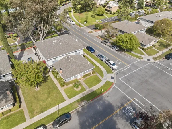 an aerial view of a house with a swimming pool