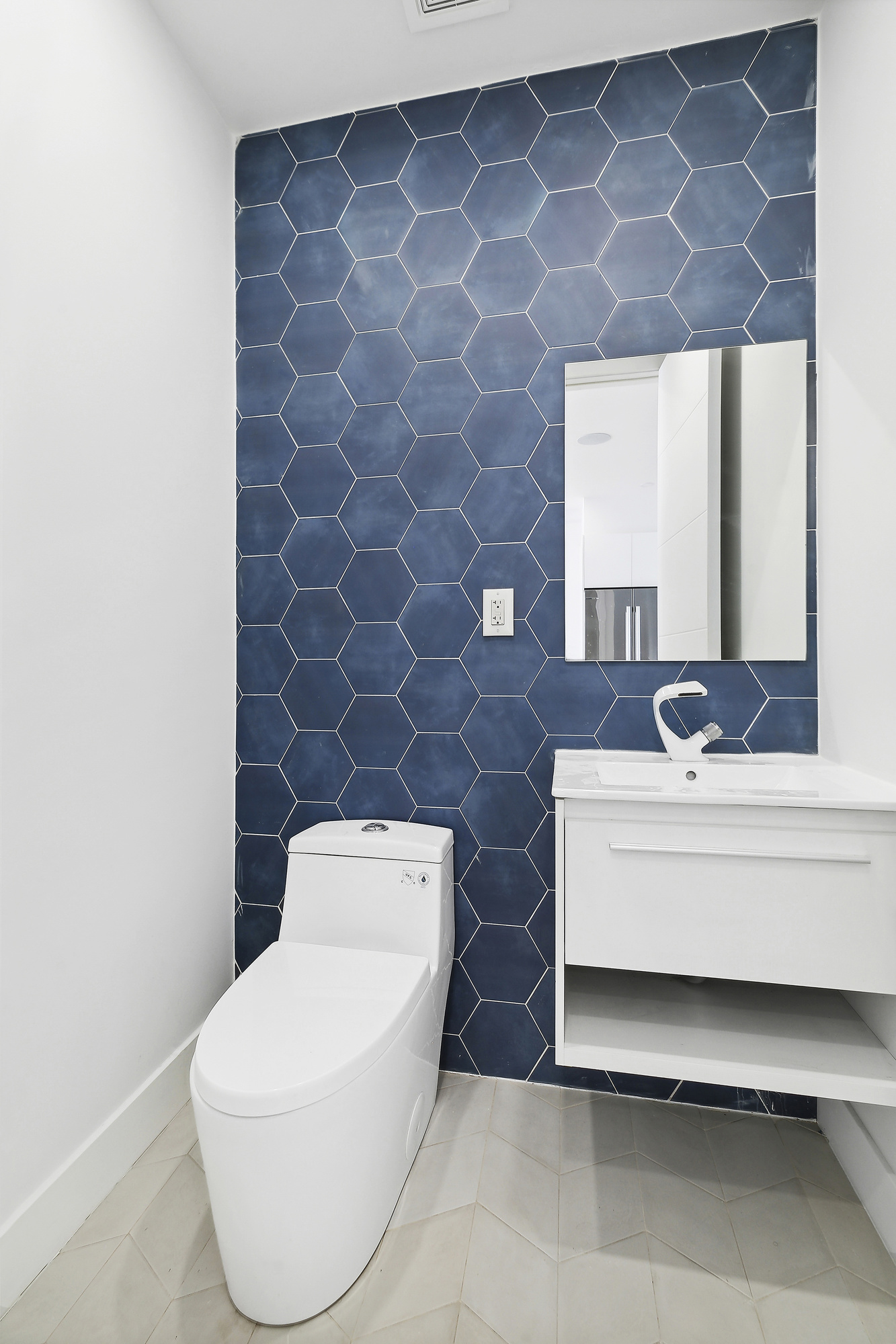 483 Hart Street, Unit 2 Brooklyn, NY 11221 - Photo 14 of 17 a bathroom with a toilet a sink and mirror