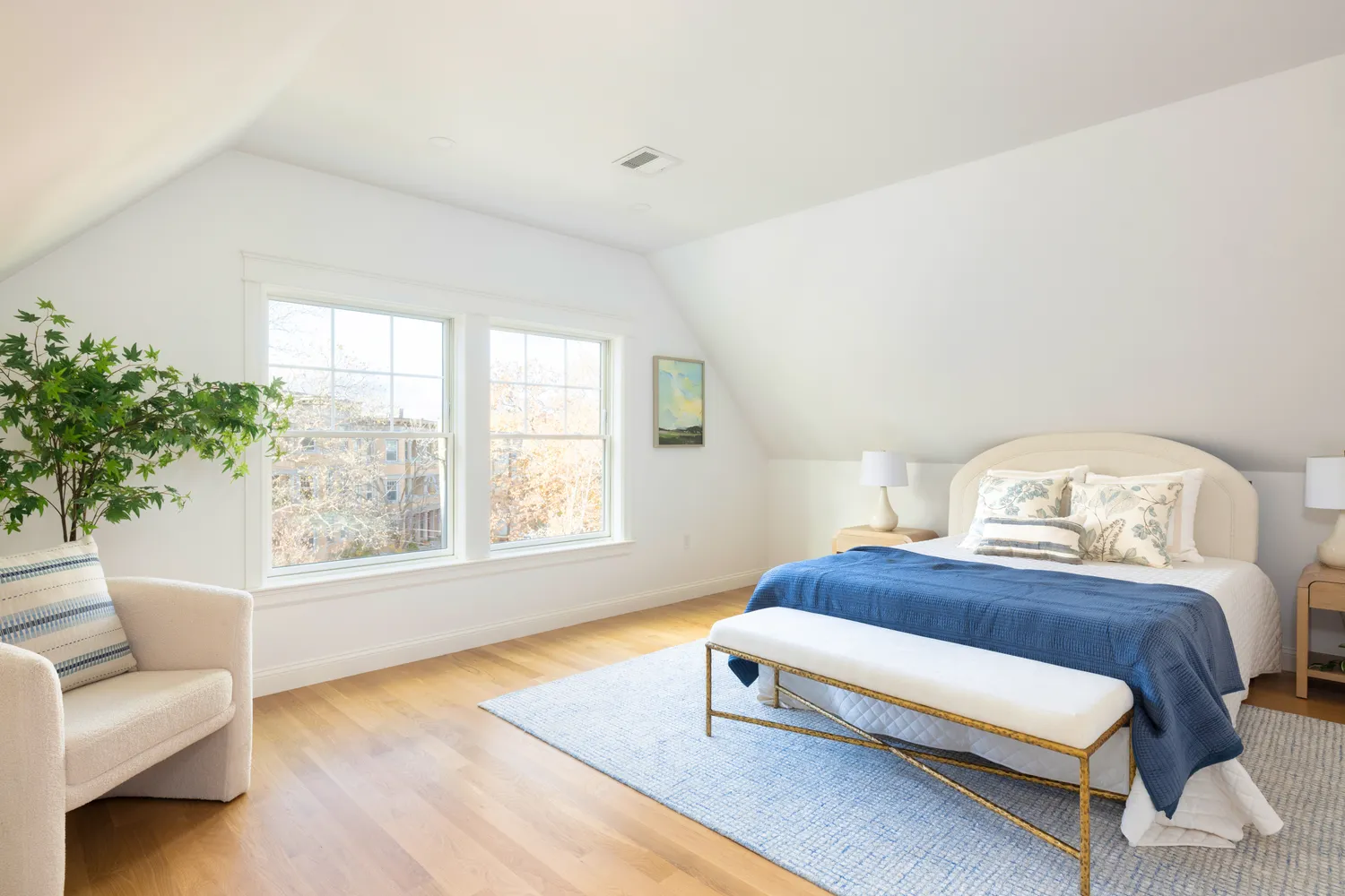 a bedroom with furniture and a window