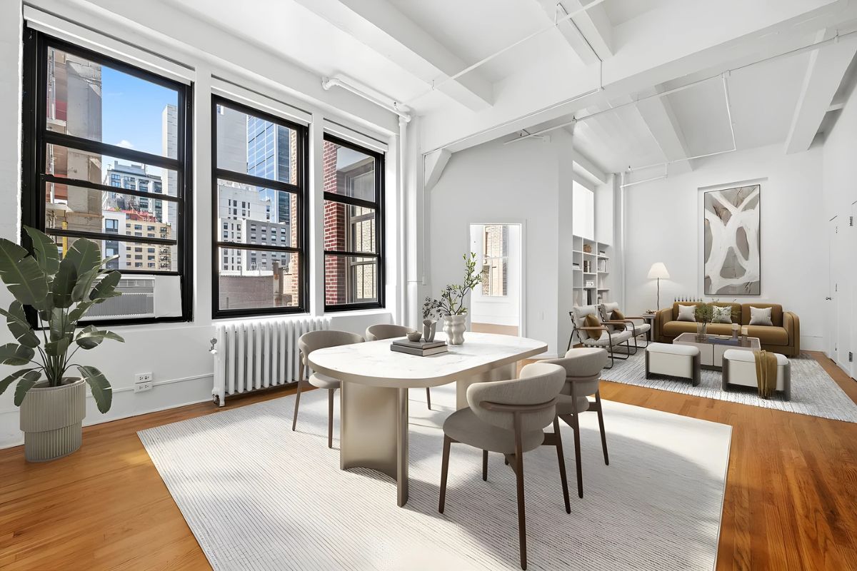 a living room with furniture a table and large windows