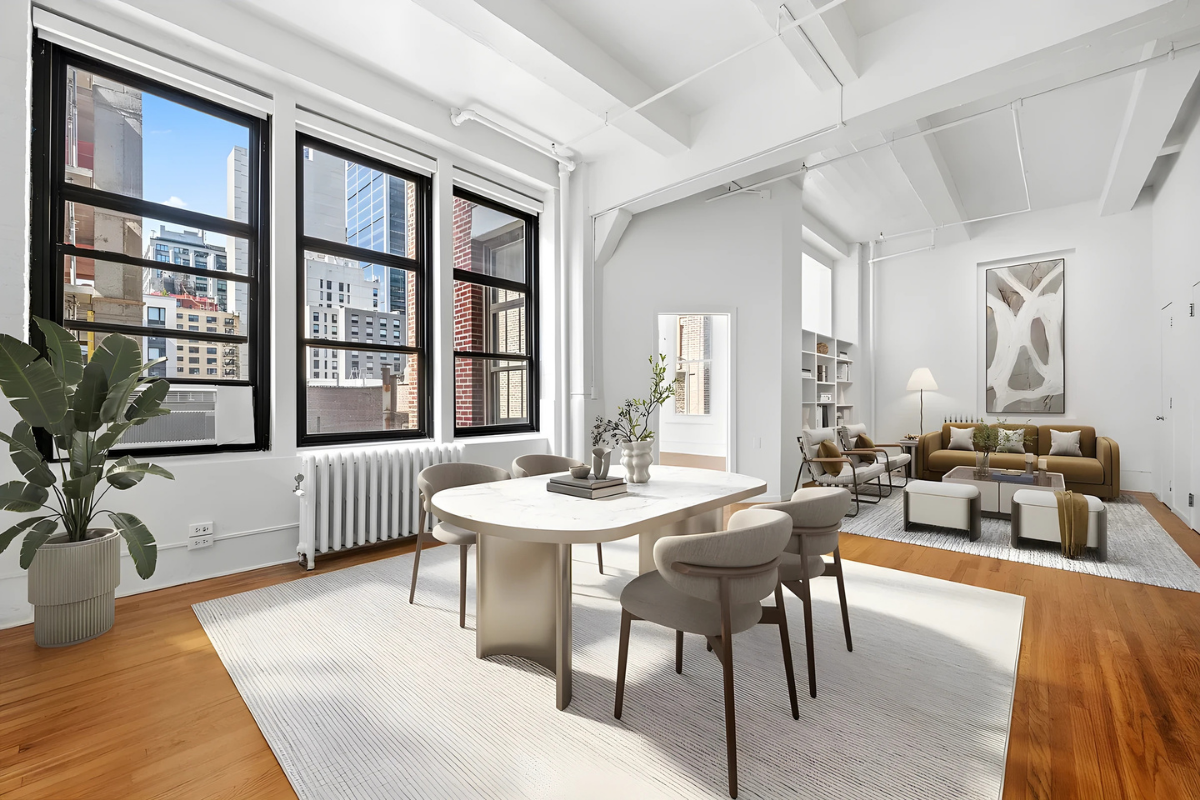 a living room with furniture a table and large windows