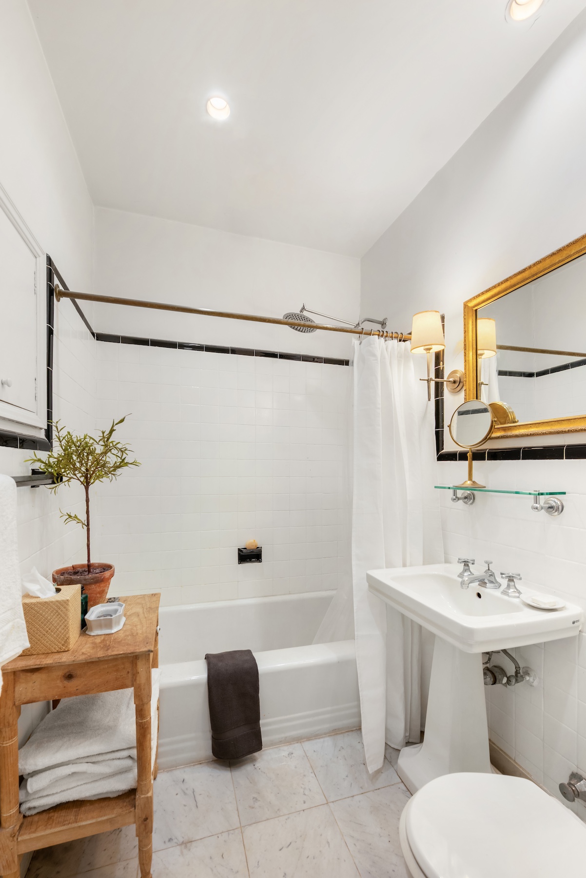 64 East 80th Street Manhattan, NY 10075 - Photo 11 of 14 a bathroom with a sink toilet and shower