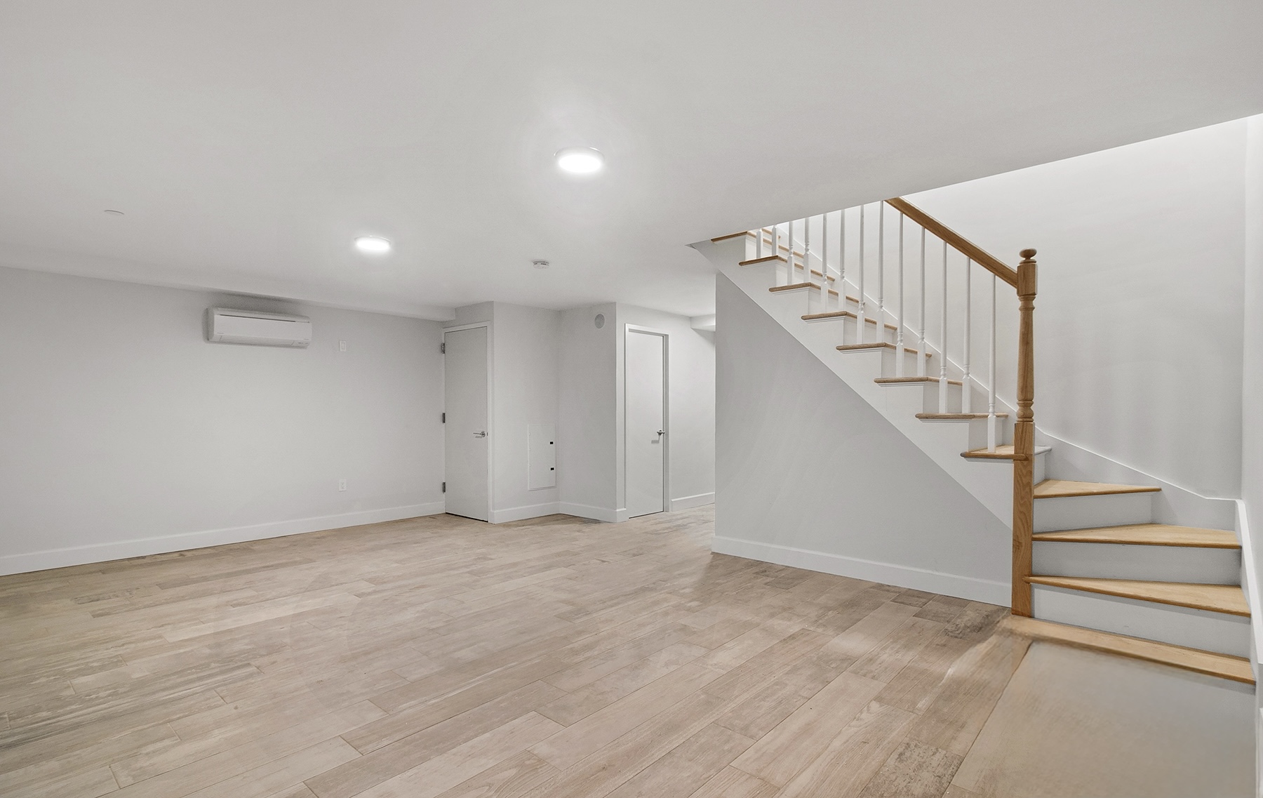 1098 Madison Street, Unit 1B Brooklyn, NY 11221 - Photo 9 of 16 a view of an empty room with stairs