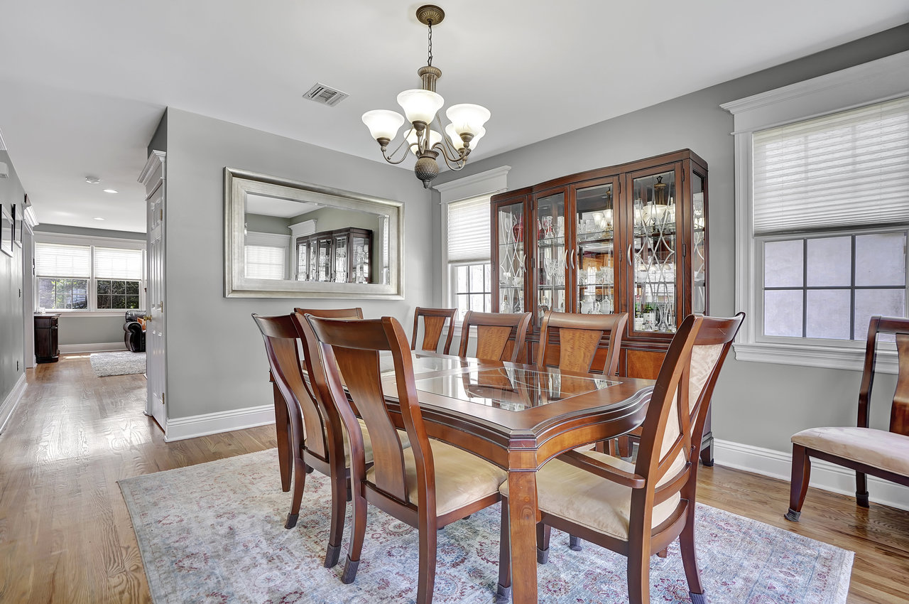 266 Feronia Way Rutherford, NJ 07070 - Photo 9 of 41 a dining room with furniture a chandelier and wooden floor