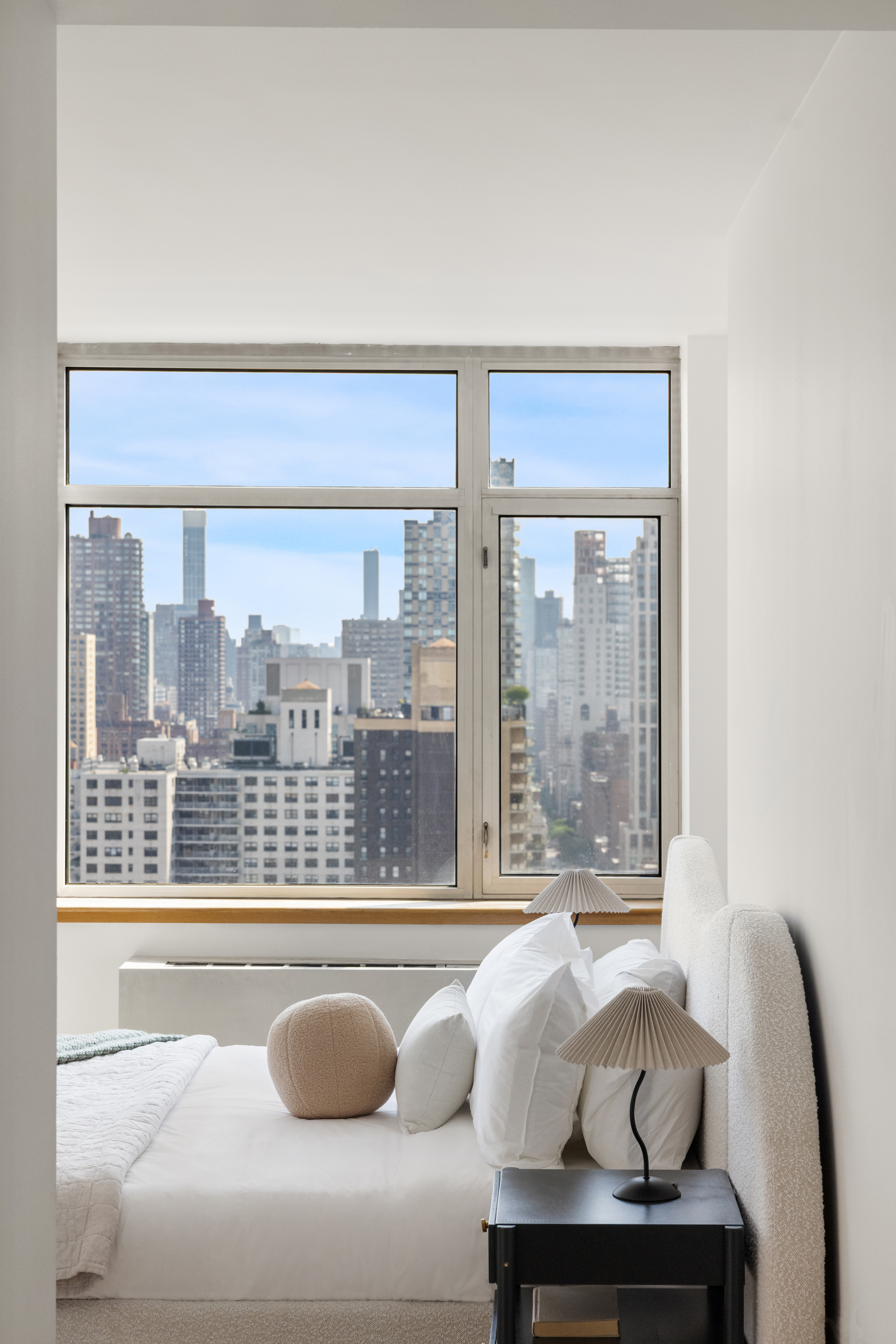 1760 2nd Avenue, Unit 30C Manhattan, NY 10128 - Photo 7 of 21 a living room with couch and a large window