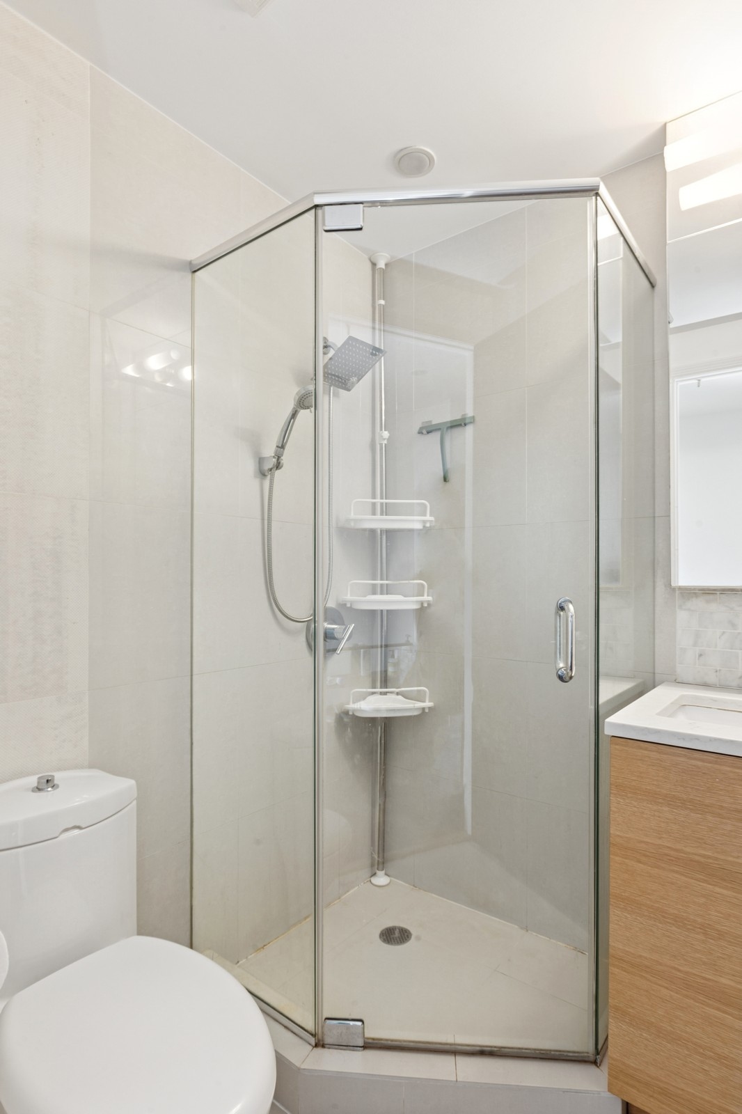 154 Skillman Avenue, Unit 5A Brooklyn, NY 11211 - Photo 8 of 11 a bathroom with a shower a toilet and a sink