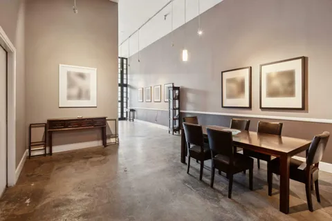 a living room with furniture a rug and a window