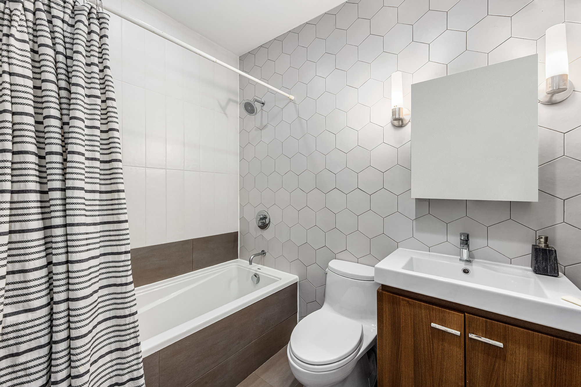 664 Jefferson Avenue, Unit 2R Brooklyn, NY 11221 - Photo 5 of 10 a bathroom with a sink a toilet and shower