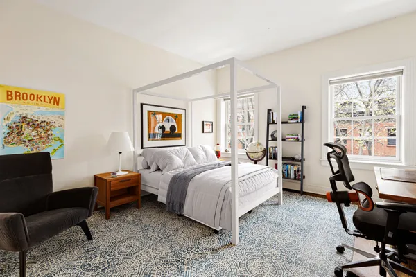 a bathroom with a granite countertop toilet a sink and a bathtub