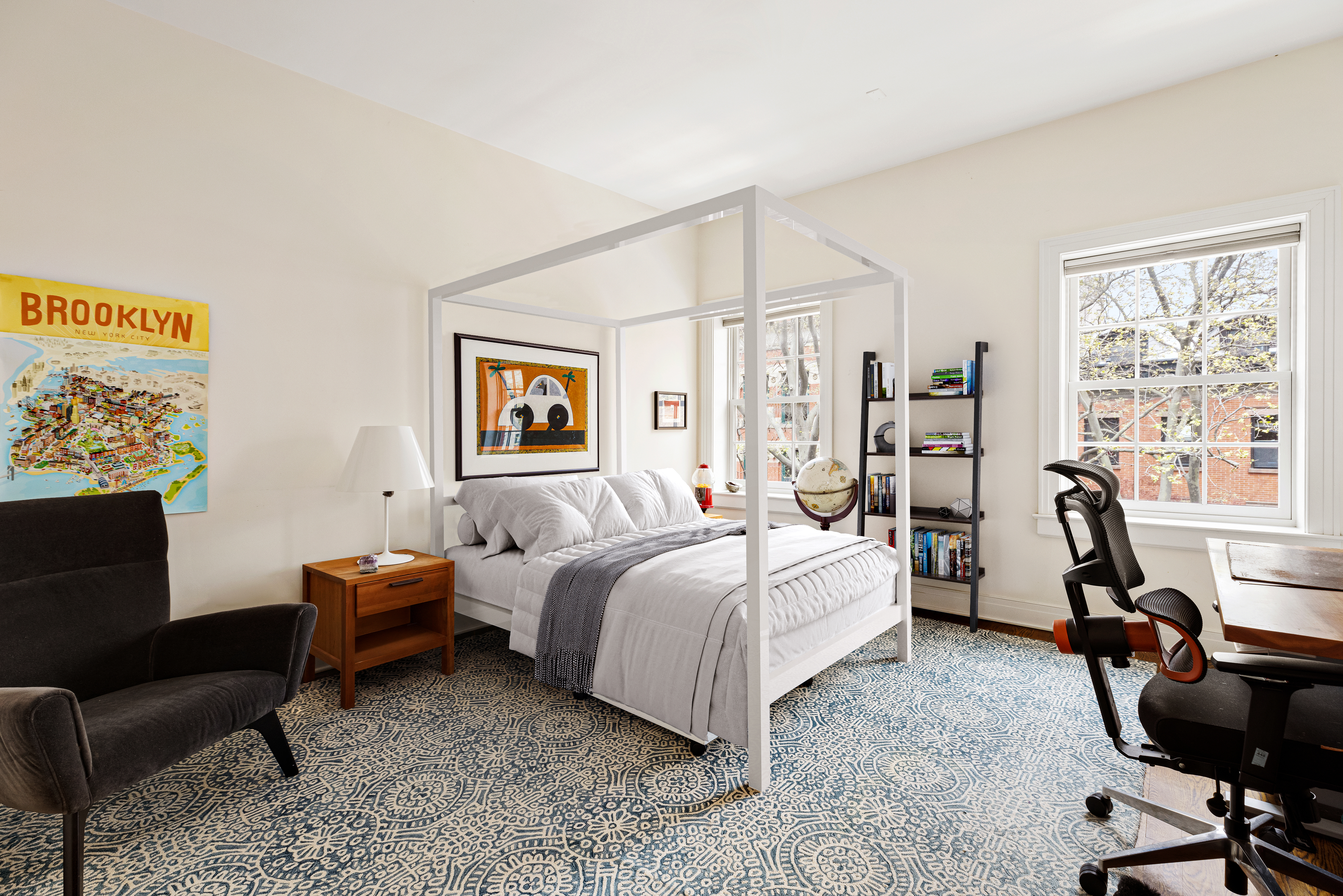 126 Pacific Street Brooklyn, NY 11201 - Photo 13 of 16 a bedroom with a bed a couch and a window