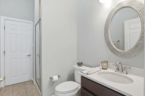 a bathroom with a sink double vanity and a mirror