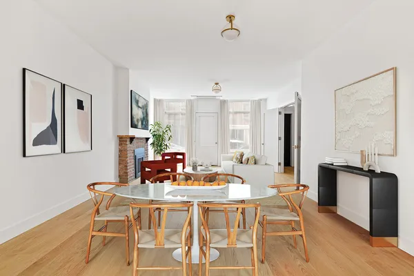 a dining room with furniture and wooden floor