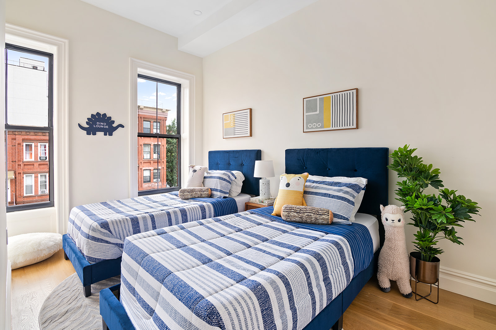 371 Herkimer Street Brooklyn, NY 11213 - Photo 9 of 16 a bedroom with bed and a potted plant