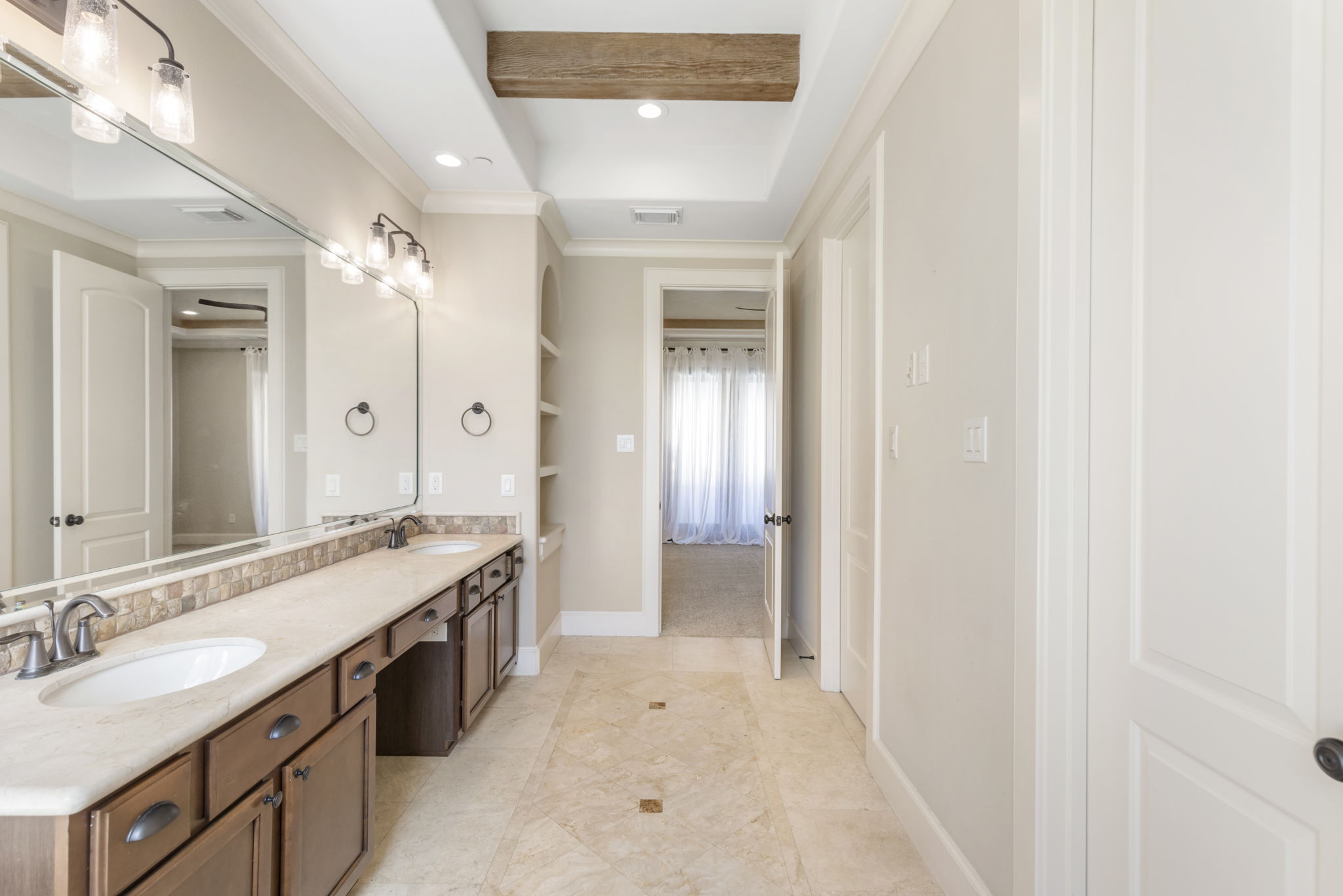 5407 Feagan Street Houston, TX 77007 - Photo 22 of 43 a spacious bathroom with a double vanity sink and a mirror