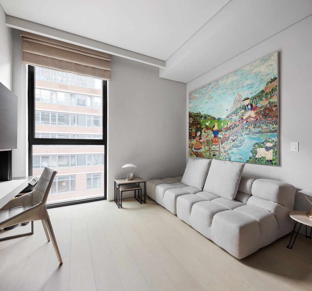 522 West 29th Street, Unit PH9C Manhattan, NY 10001 - Photo 9 of 16 a living room with furniture and a window