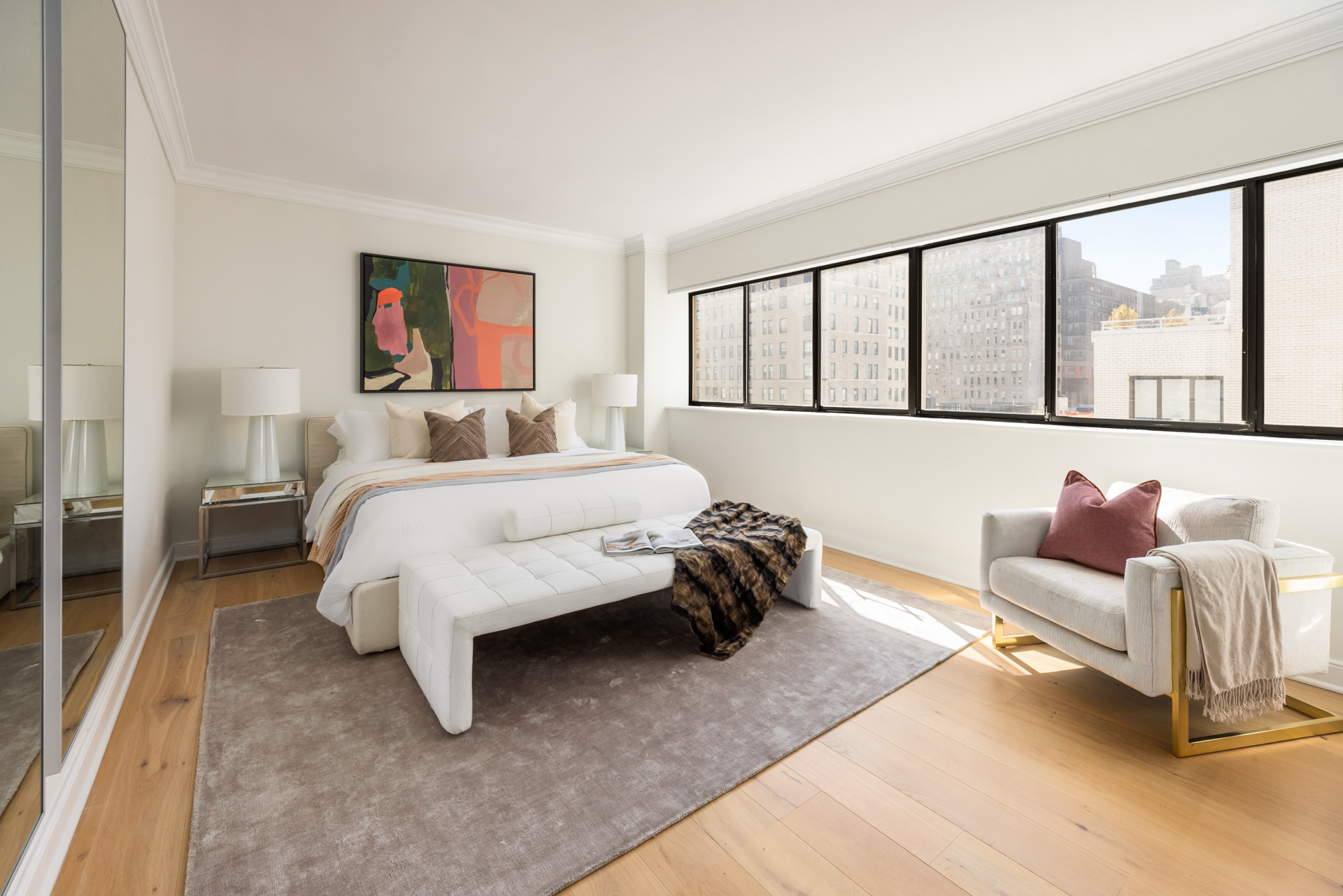 32 East 76th Street, Unit 805 Manhattan, NY 10021 - Photo 8 of 15 a bedroom with a bed and a large window