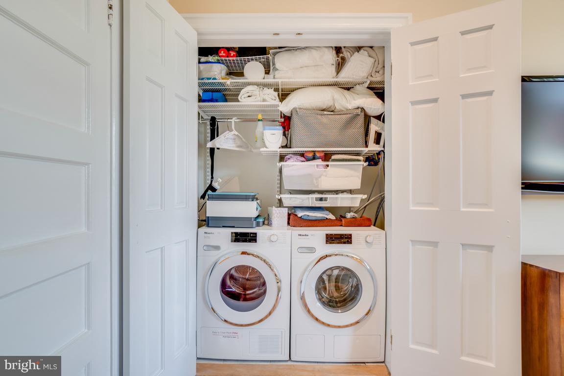 2415 20th Street Northwest, Unit 38 Washington, DC 20009 - Photo 23 of 30 a utility room with dryer and washer