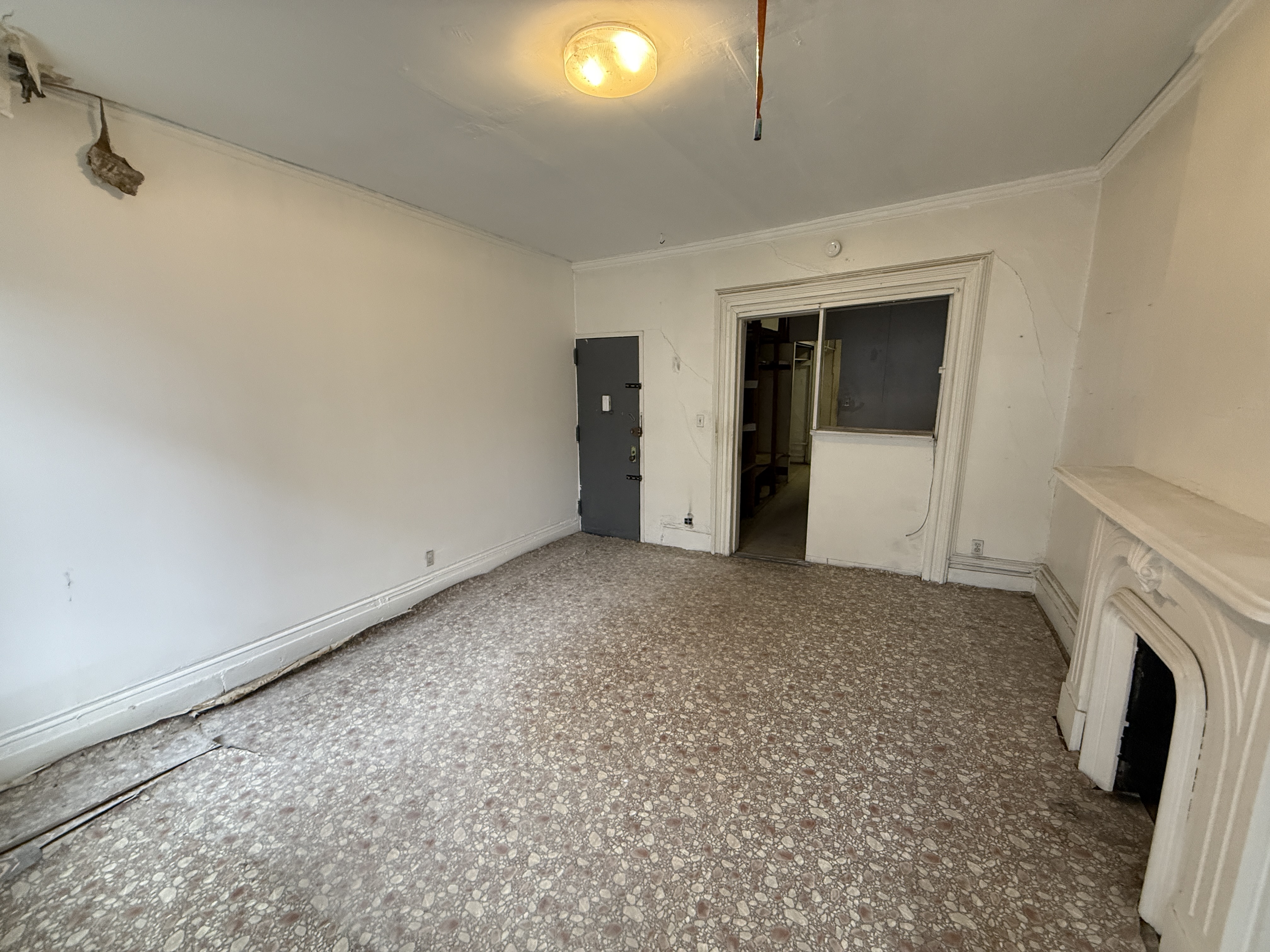 320 West 47th Street, Unit 4W Manhattan, NY 10036 - Photo 10 of 11 a view of empty room with fireplace