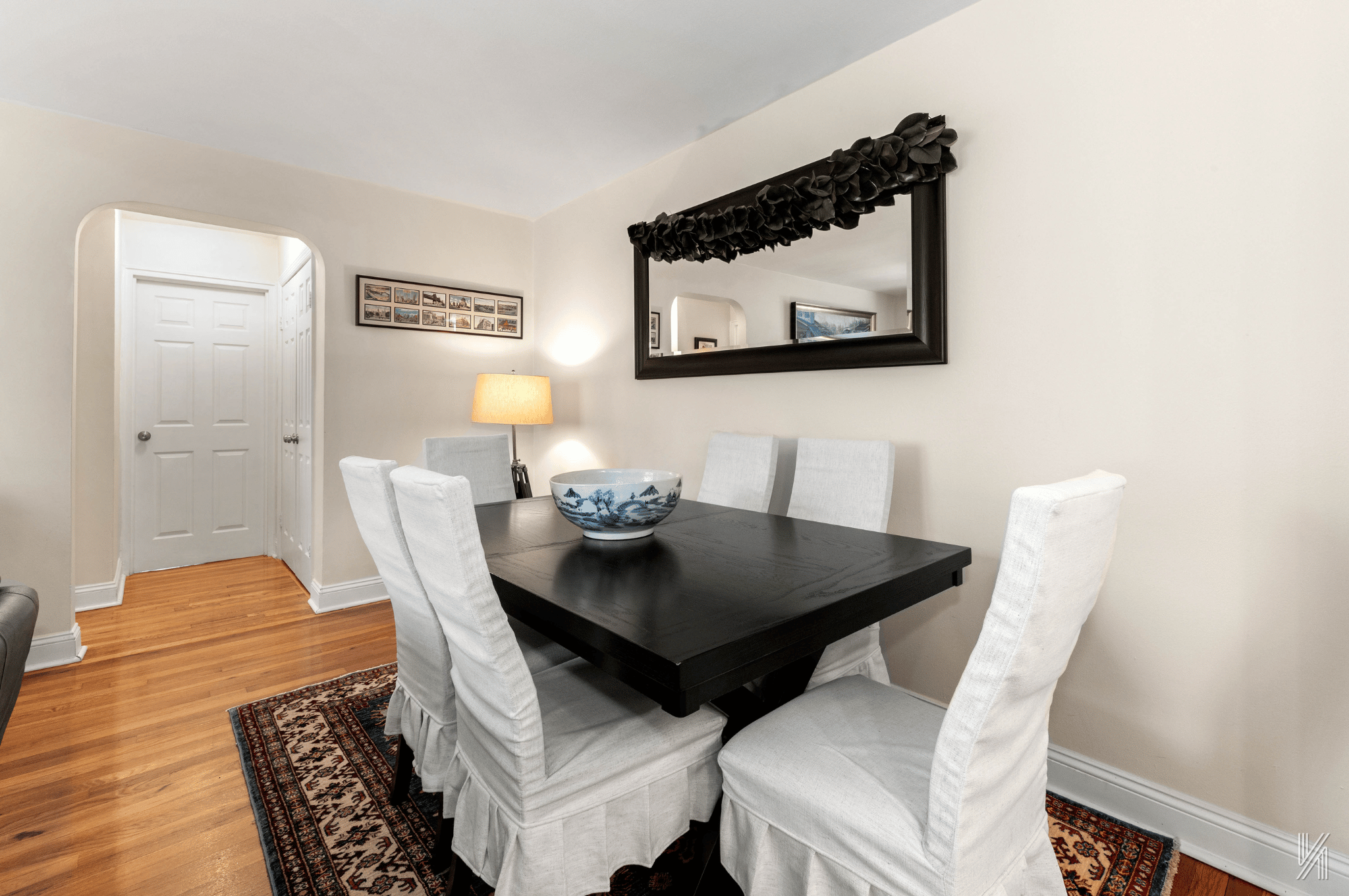 22-40 80th Street, Unit 3B Queens, NY 11370 - Photo 5 of 14 a living room with furniture and wooden floor