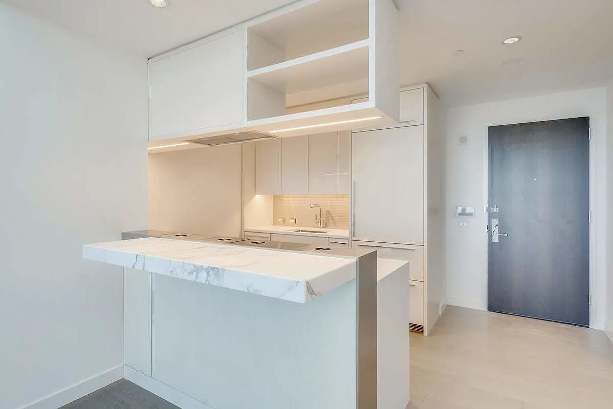 252 South Street, Unit 52J Manhattan, NY 10002 - Photo 4 of 17 a utility room with dryer and washer