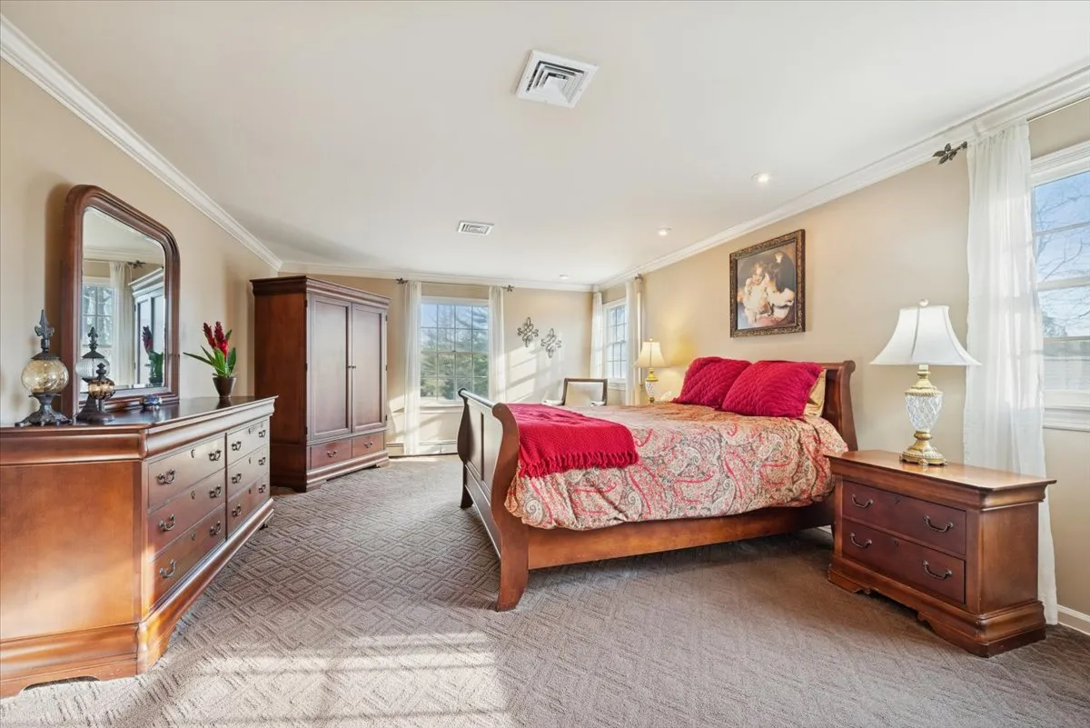 a bathroom with a double vanity sink mirror and shower