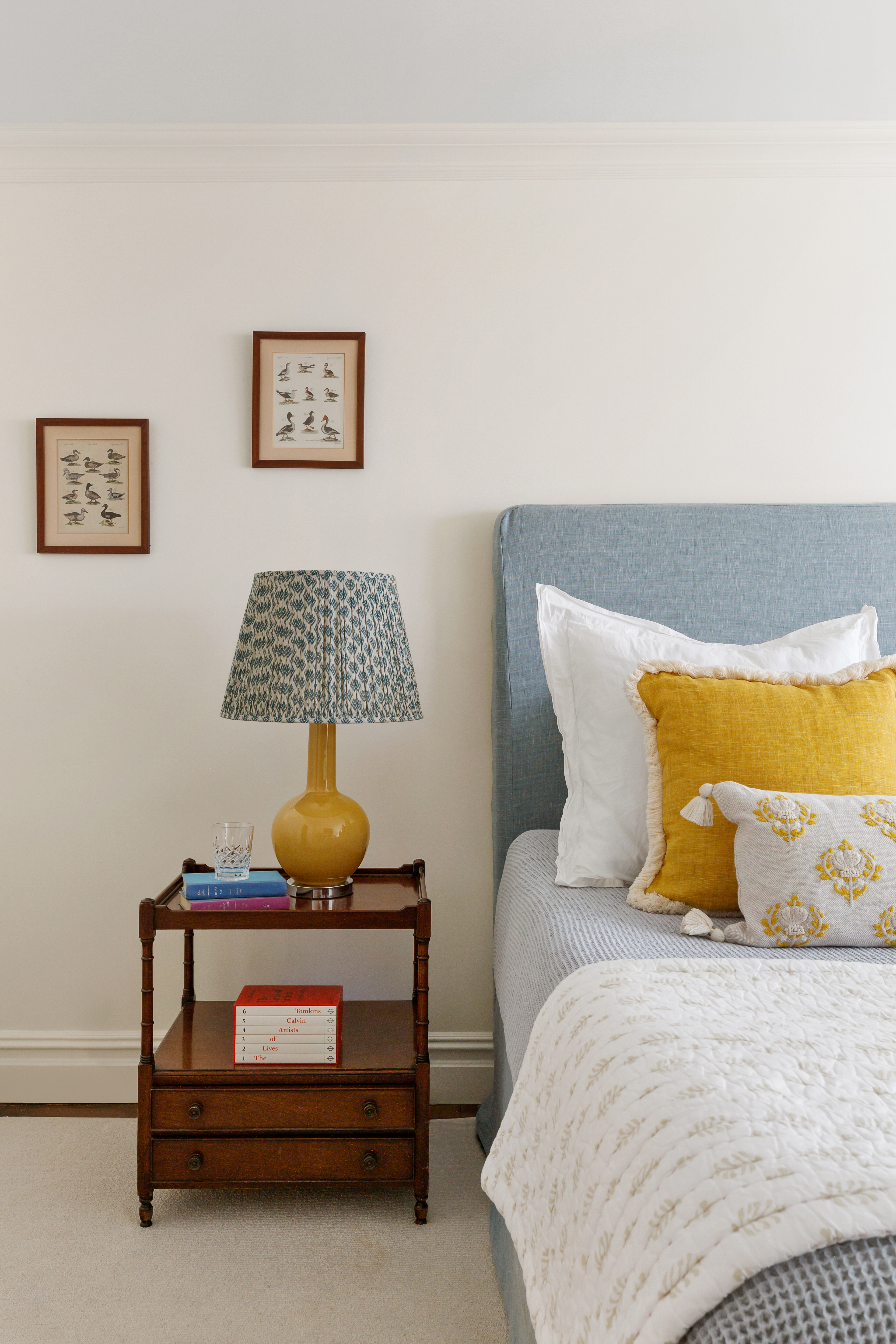 174 East 74th Street, Unit 3A Manhattan, NY 10021 - Photo 6 of 11 a bedroom with a bed and lamp