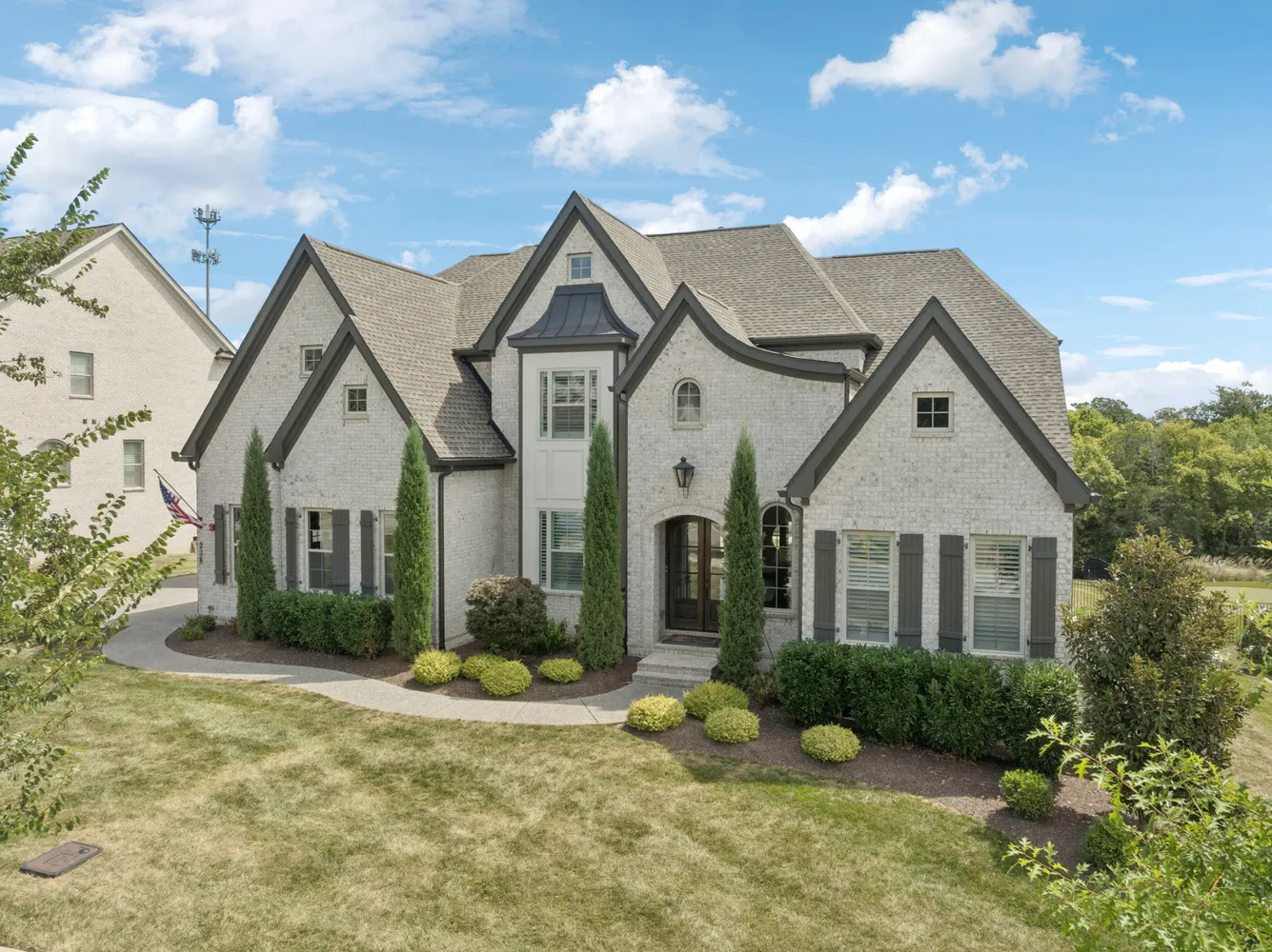 a front view of a house with garden