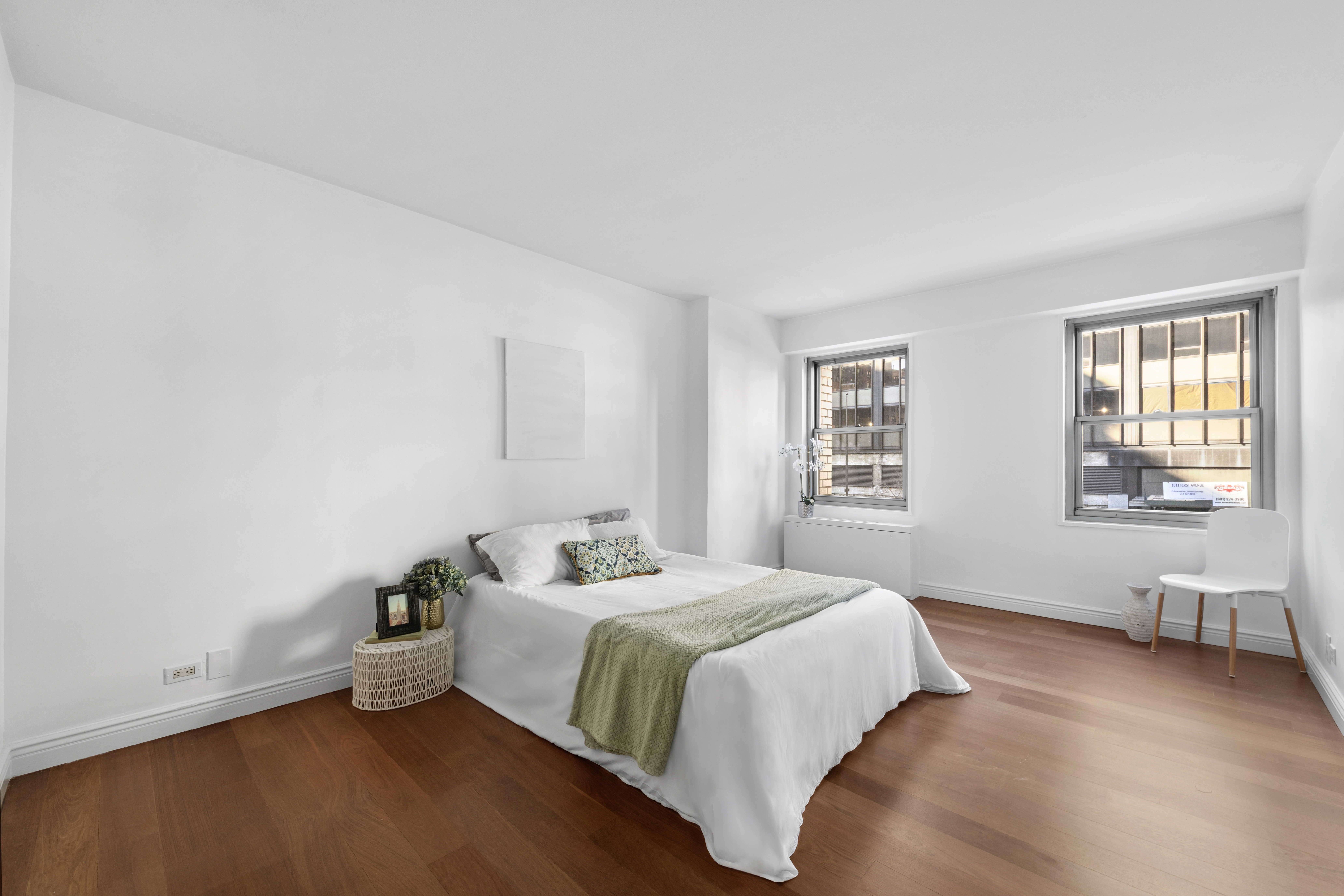 400 East 56th Street, Unit 3D Manhattan, NY 10022 - Photo 12 of 24 a spacious bedroom with a bed and window