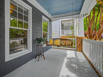 a view of an entryway with wooden floor and door