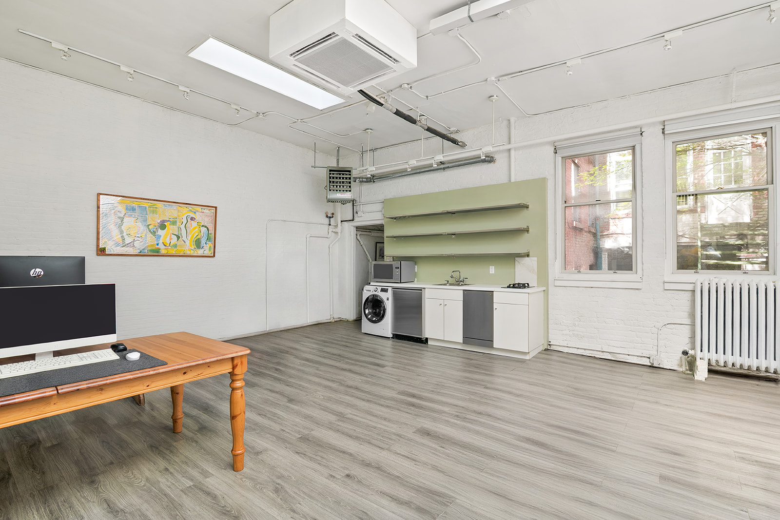 198 6th Avenue Manhattan, NY 10013 - Photo 38 of 45 a room with wooden floor and window