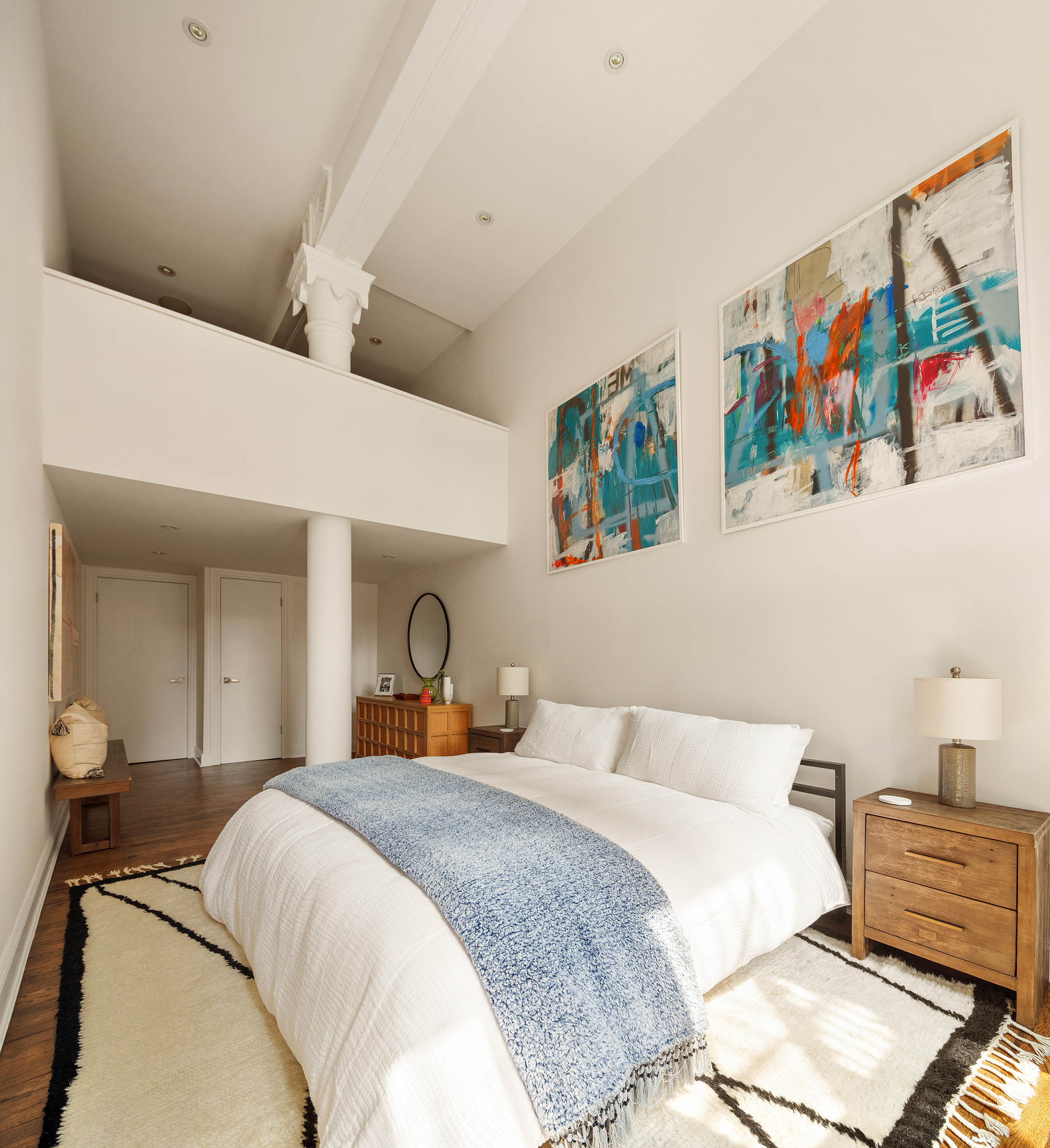 250 Mercer Street, Unit C302 Manhattan, NY 10012 - Photo 6 of 24 a bedroom with a bed and cupboard