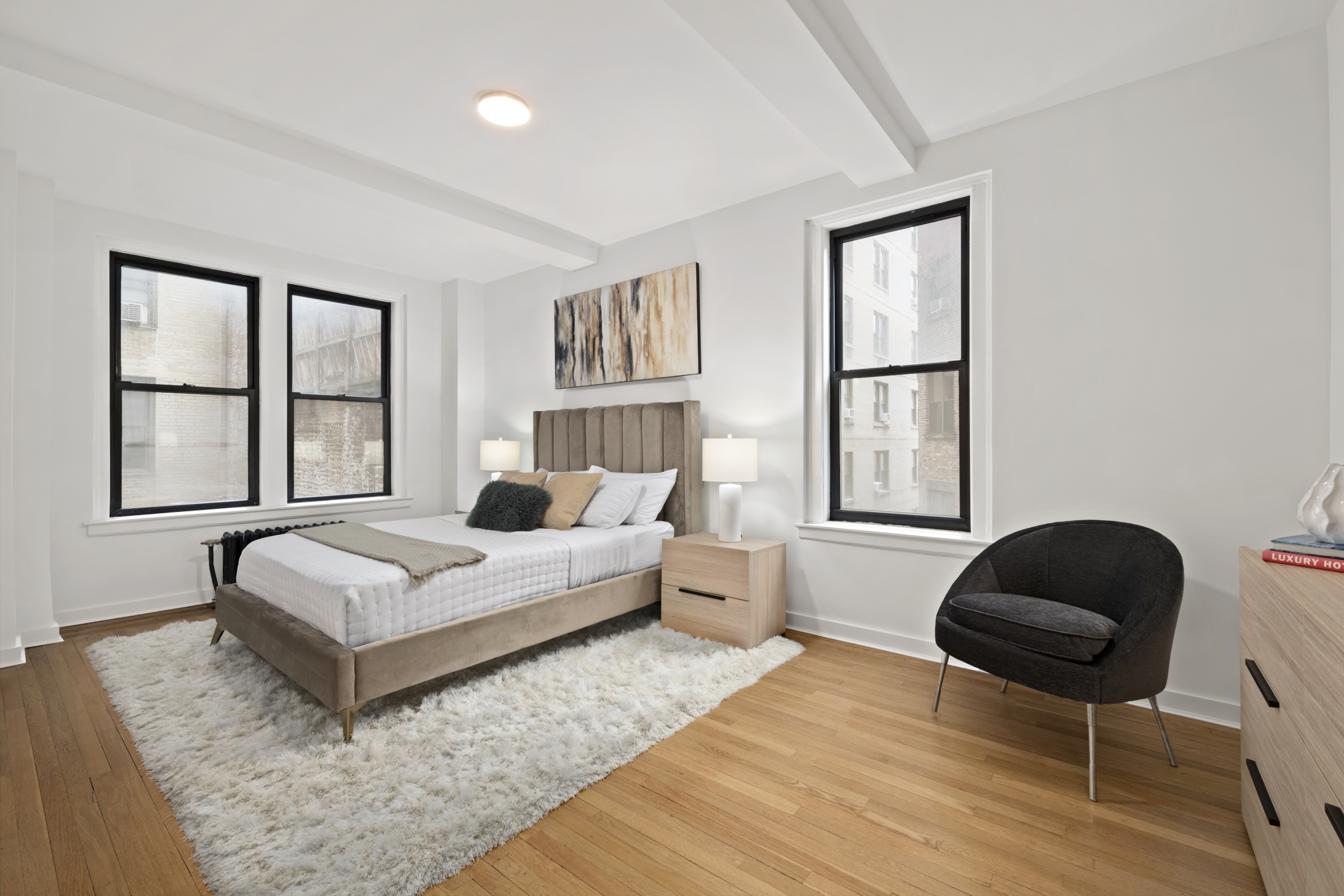 33 Riverside Drive, Unit 5D Manhattan, NY 10023 - Photo 5 of 7 a living room with furniture and a large window