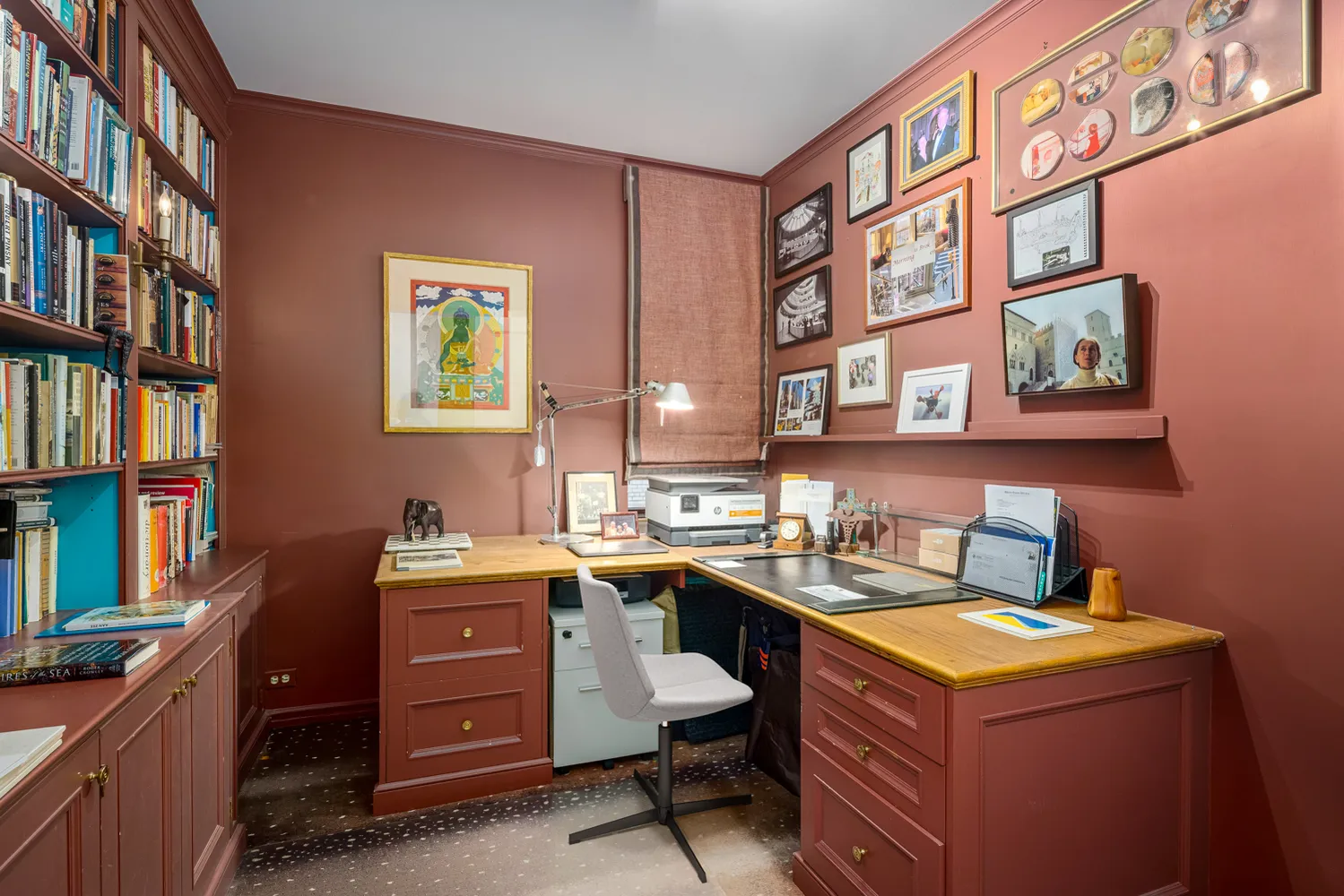 a room with a desk and cabinets