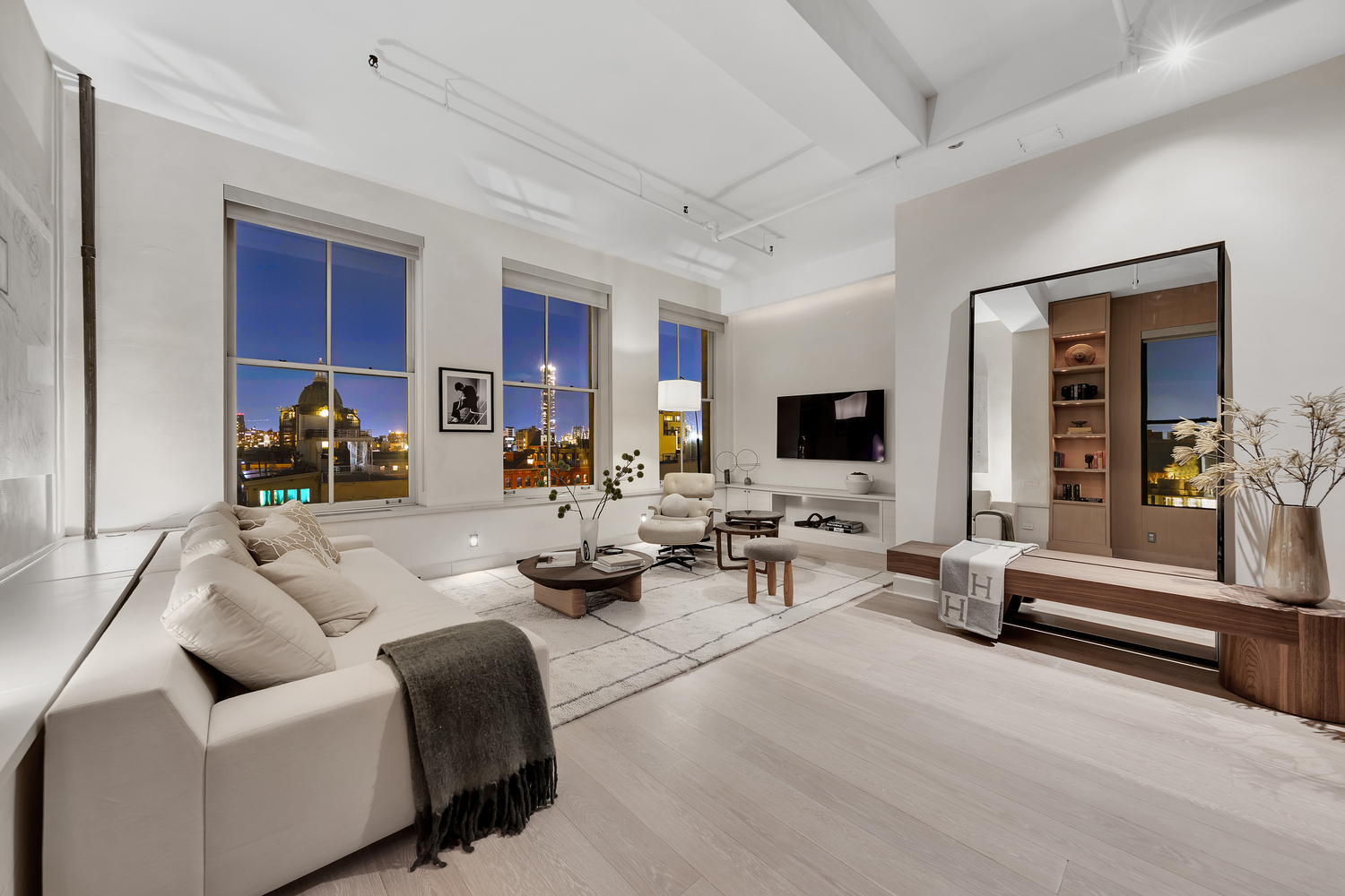 38 Crosby Street, Unit 8 Manhattan, NY 10013 - Photo 15 of 27 a living room with furniture and a flat screen tv