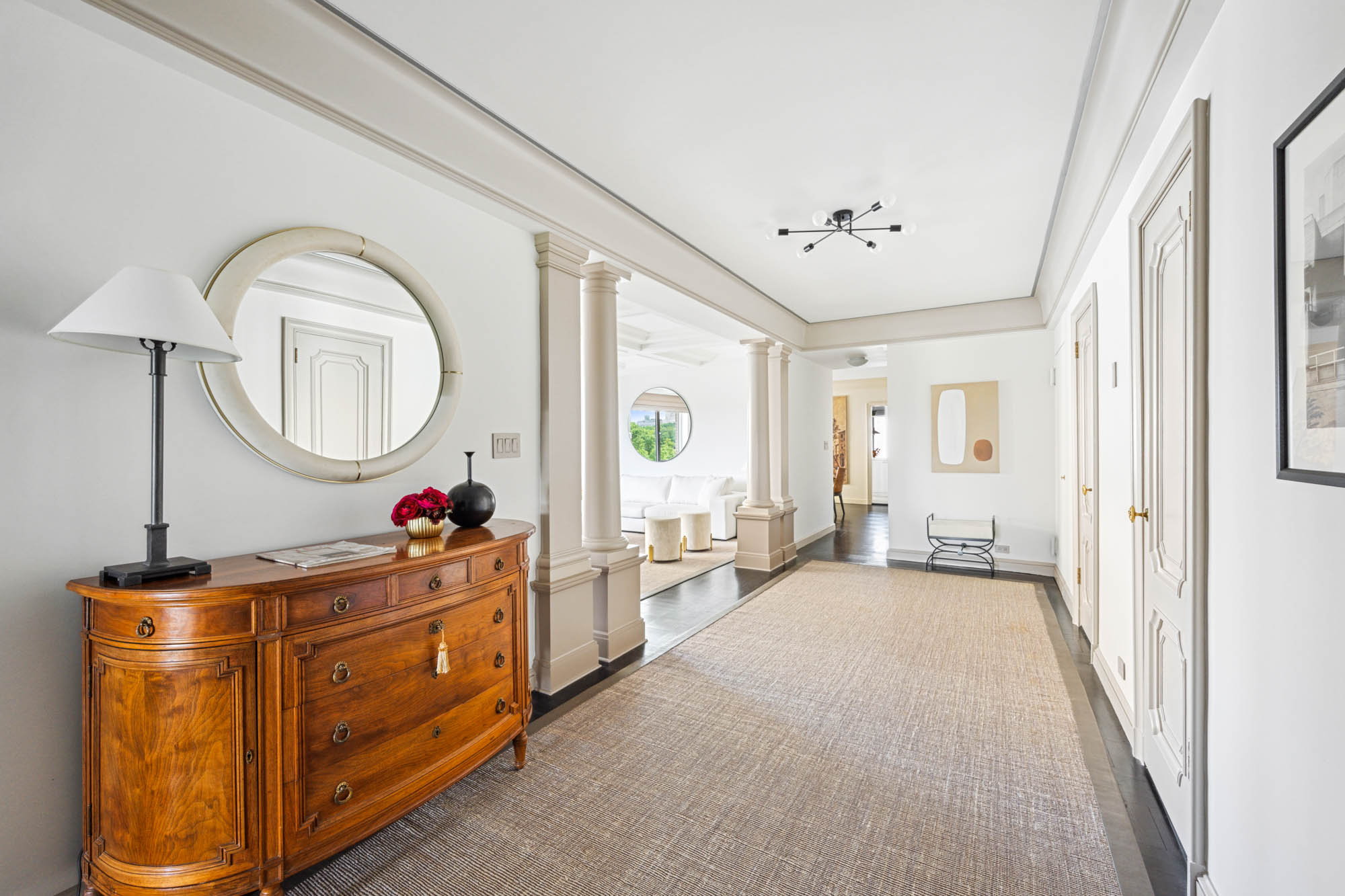 936 5th Avenue, Unit 10AB Manhattan, NY 10021 - Photo 6 of 37 a living room with furniture a table and window