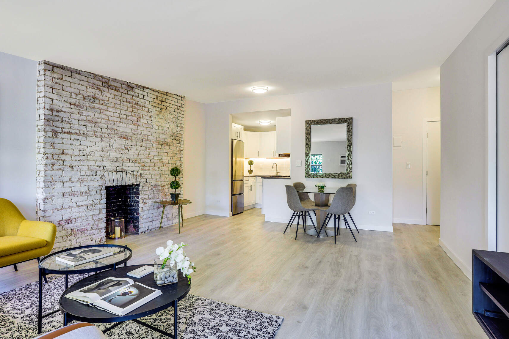 237 East 17th Street, Unit 520 Manhattan, NY 10003 - Photo 5 of 14 a living room with furniture and a fireplace