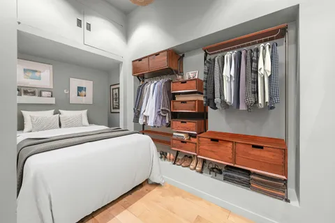 a bedroom with furniture and window