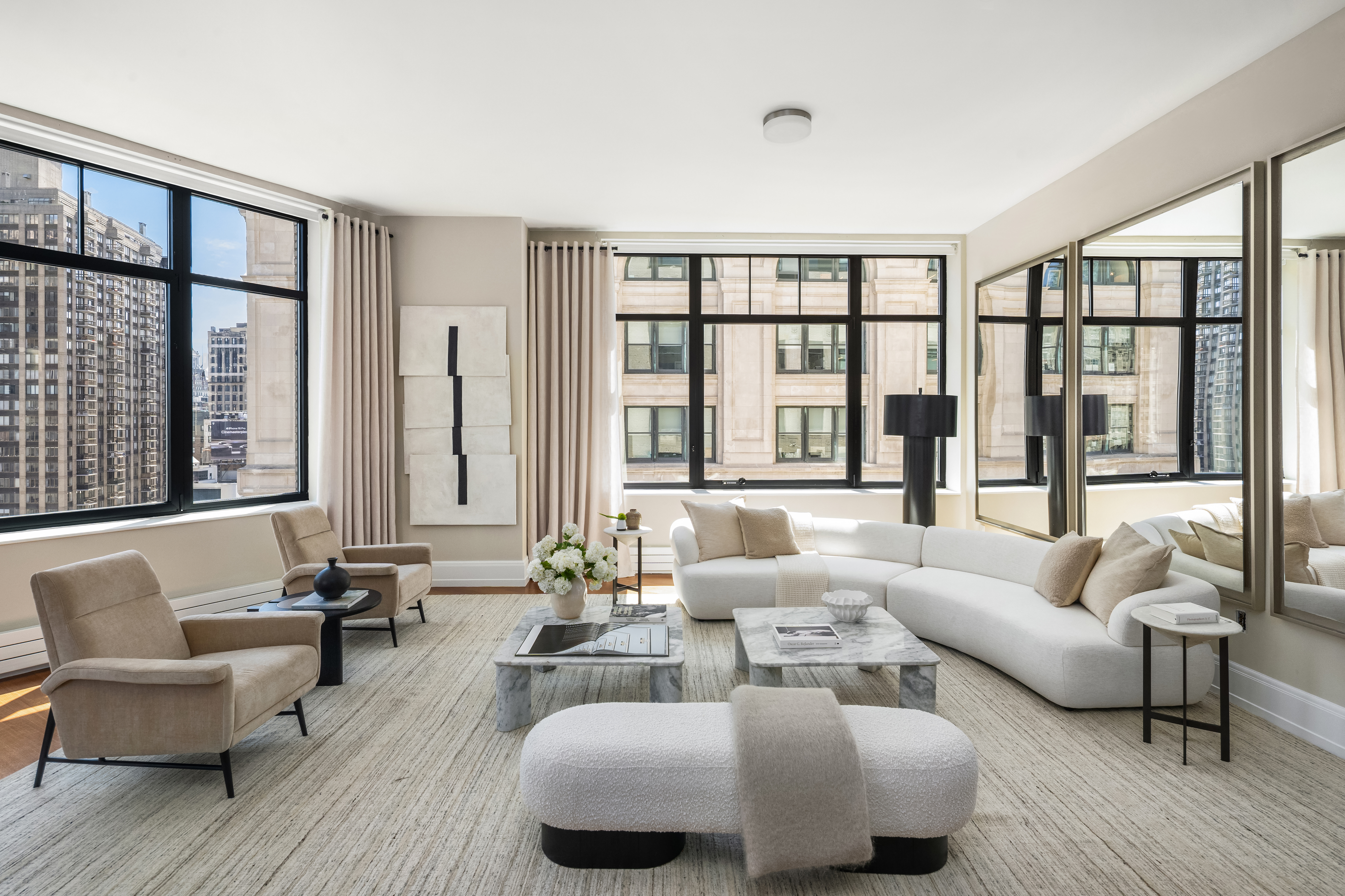 10 Madison Square West, Unit 12D Manhattan, NY 10010 - Photo 9 of 21 a living room with furniture and a large window with outer view