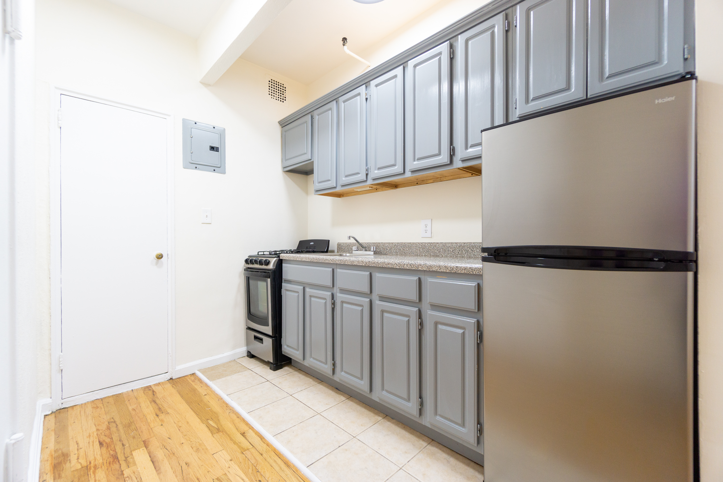 319 East 25th Street, Unit 5C Manhattan, NY 10010 - Photo 5 of 14 a view of a kitchen with electric appliances