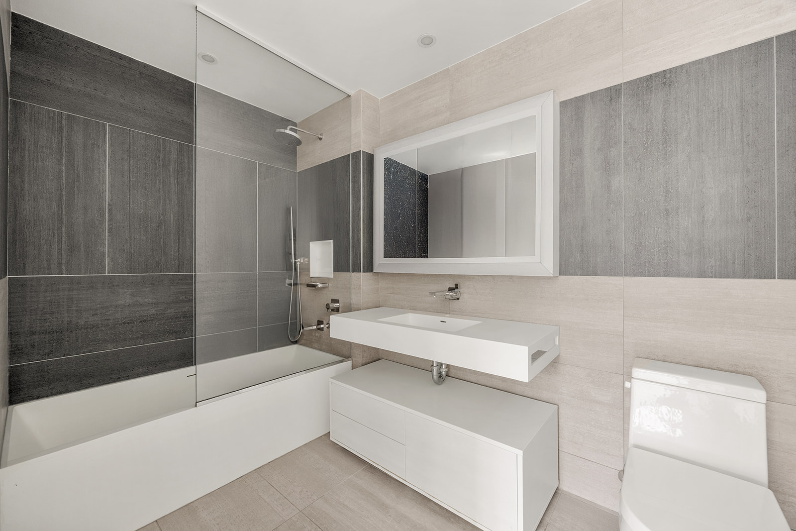 540 West 49th Street, Unit 506S Manhattan, NY 10019 - Photo 5 of 8 a bathroom with a sink a toilet and shower