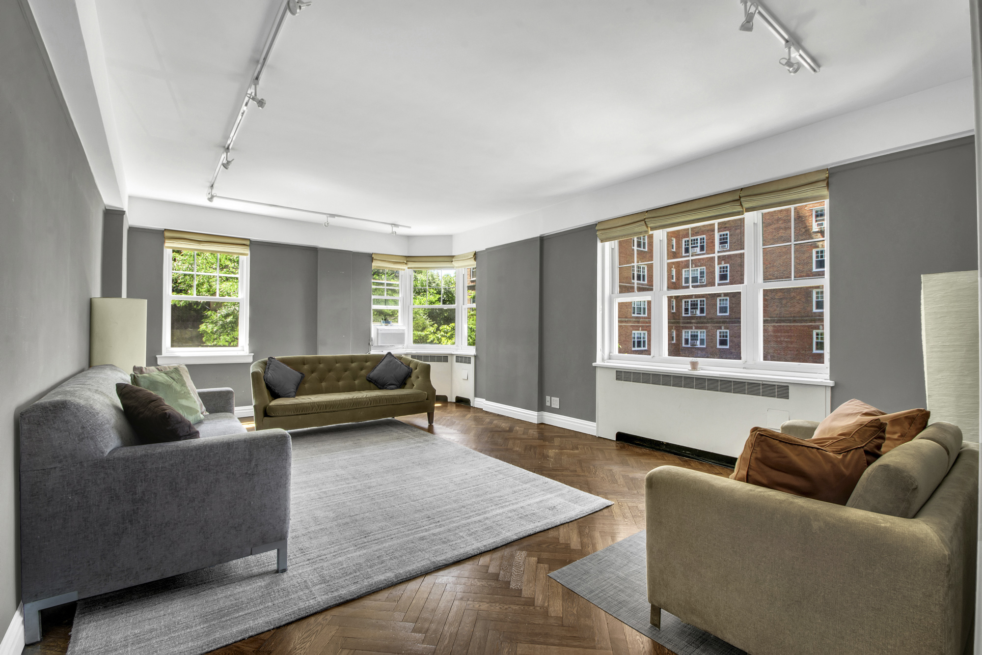 140 Cabrini Boulevard, Unit 14 Manhattan, NY 10033 - Photo 1 of 30 a living room with furniture and a window