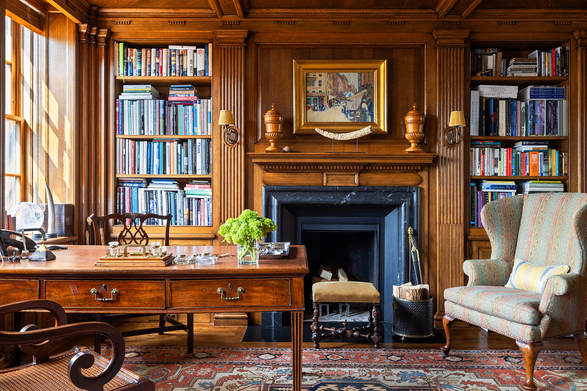 620 Park Avenue, Unit 14 Manhattan, NY 10065 - Photo 19 of 32 a living room with furniture a bookshelf and a book shelf