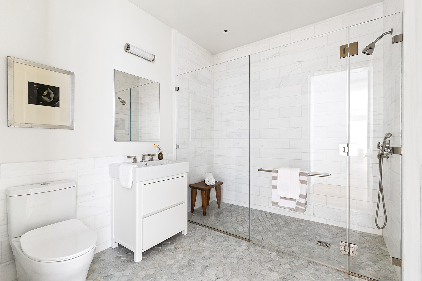 1045 Madison Avenue, Unit 3B Manhattan, NY 10075 - Photo 11 of 14 a bathroom with a sink a toilet and shower