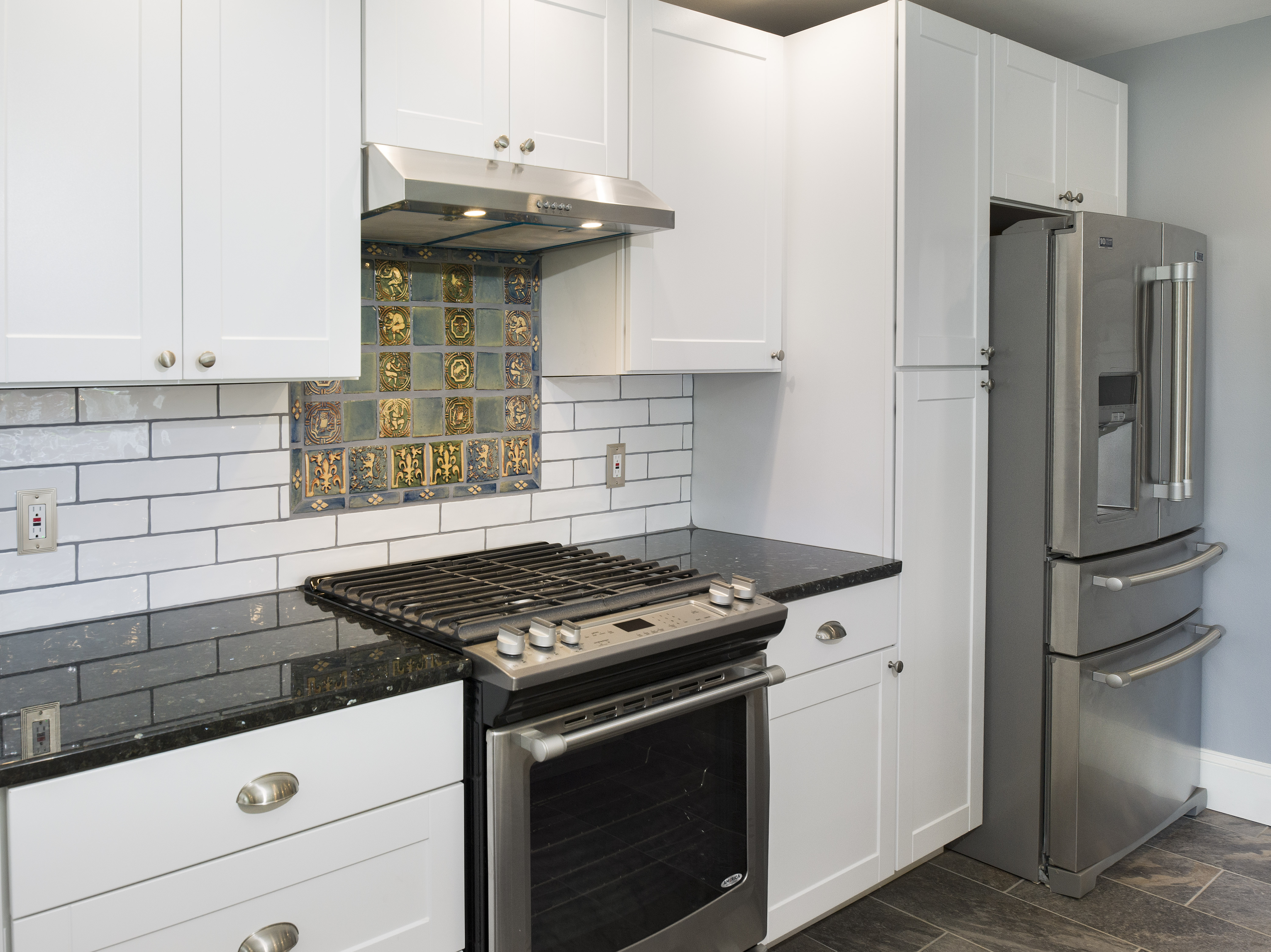 319 West Conestoga Road Devon, PA 19333 - Photo 17 of 38 a kitchen with stainless steel appliances granite countertop a stove and a refrigerator