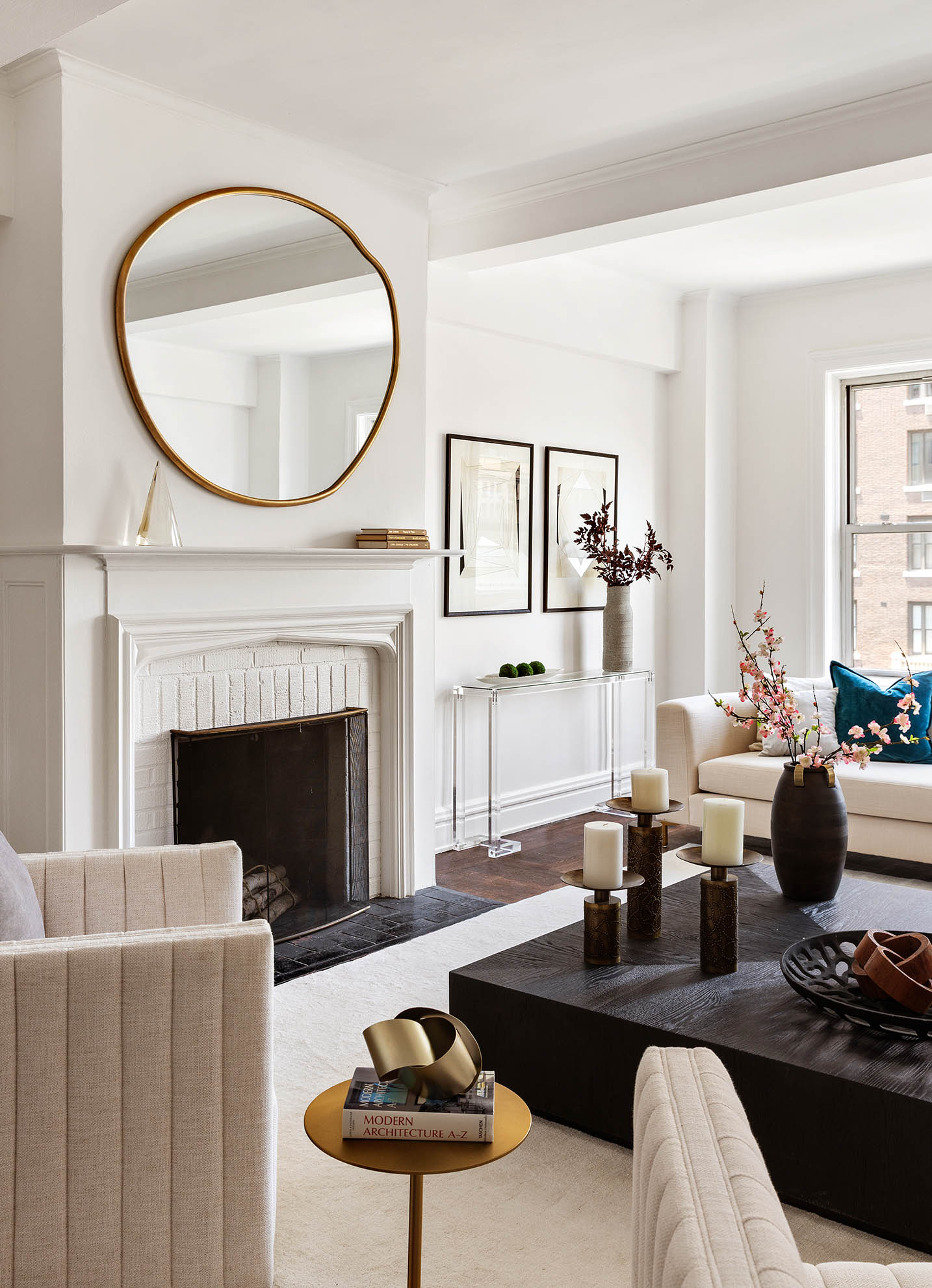 975 Park Avenue, Unit 10B Manhattan, NY 10028 - Photo 3 of 17 a living room with furniture a fireplace and a large window