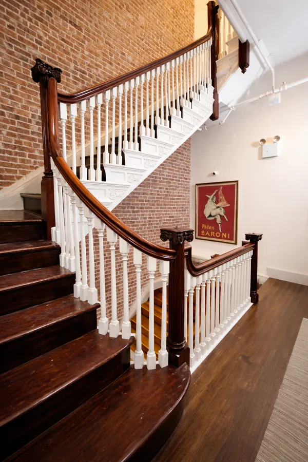 a view of entryway with wooden floor
