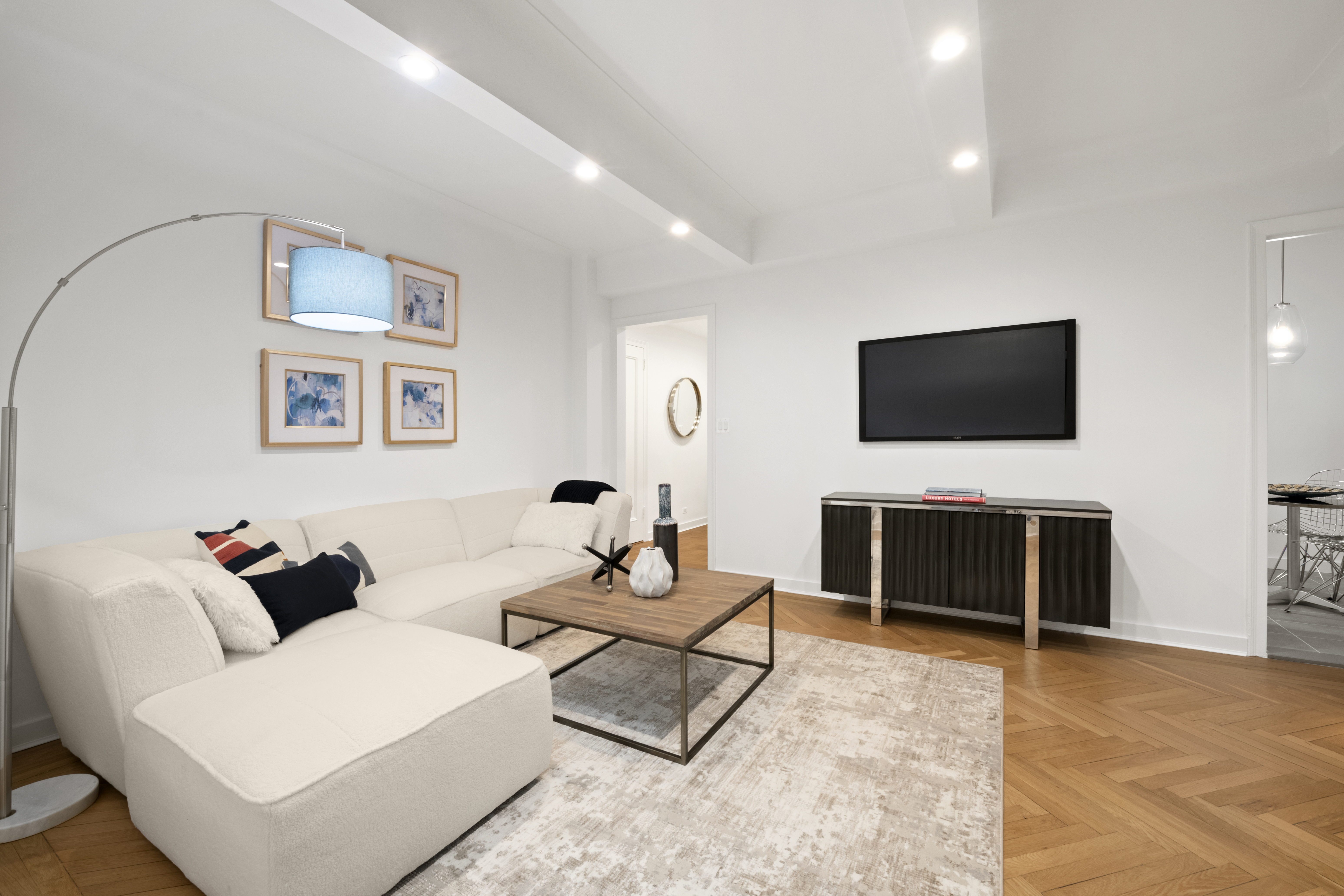 33 Riverside Drive, Unit 5D Manhattan, NY 10023 - Photo 3 of 7 a living room with furniture and a flat screen tv