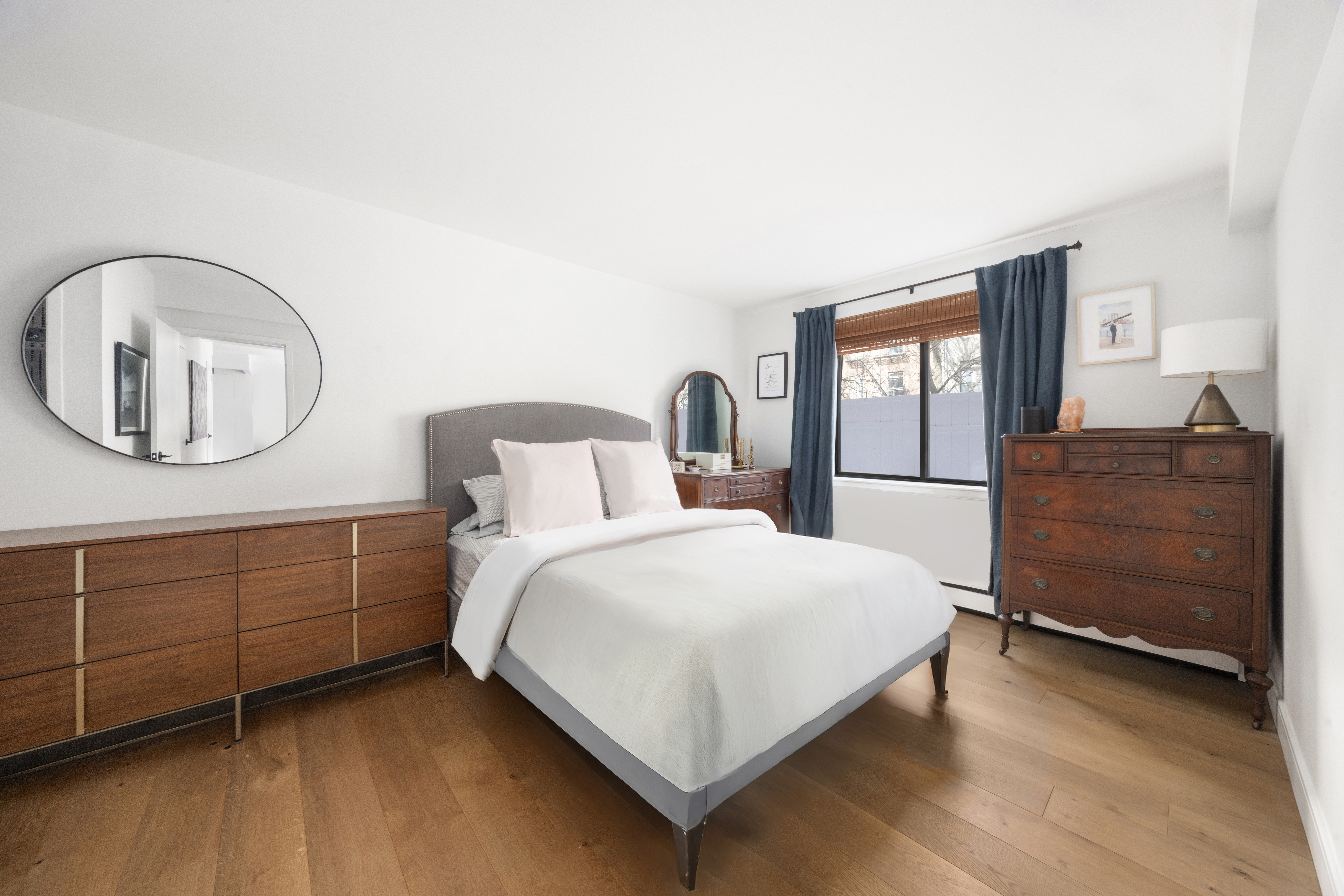 333 East 119th Street, Unit 1H Manhattan, NY 10035 - Photo 11 of 17 a bedroom with a bed and a dresser