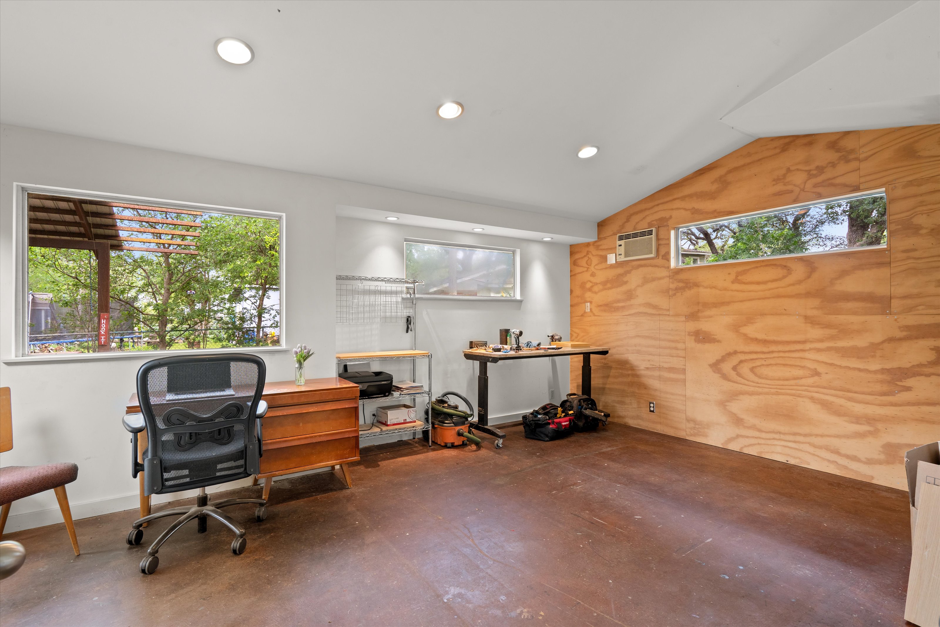 4614 Jinx Avenue Austin, TX 78745 - Photo 26 of 40 a view of a workspace with furniture and a window